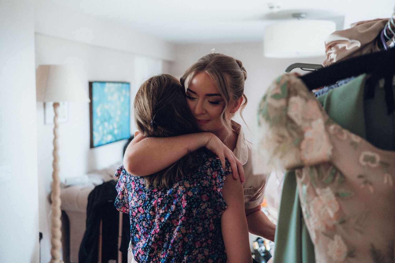 Wedding preparation scene with people getting ready in an indoor setting.