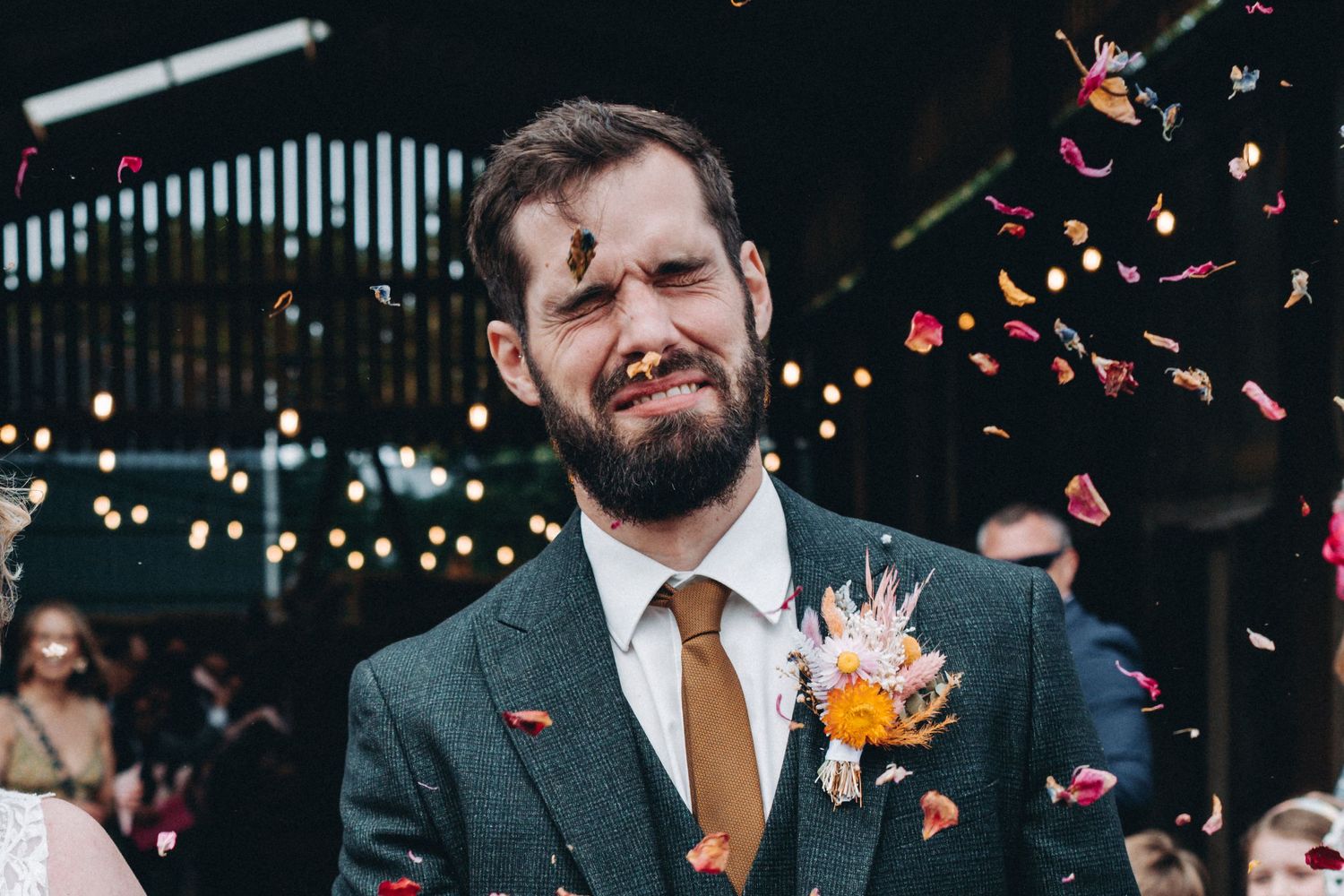 Andy getting smashed in the face with confetti.