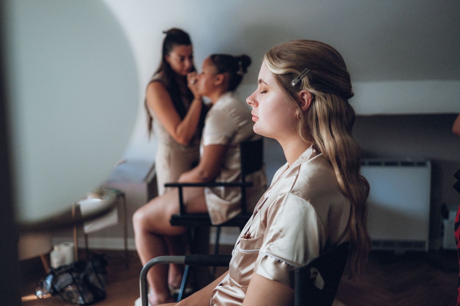 Wedding day preparations captured in a moody, artistic style.