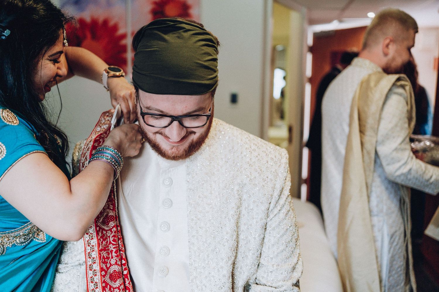 Wedding preparations showing traditional Indian henna application ceremony.