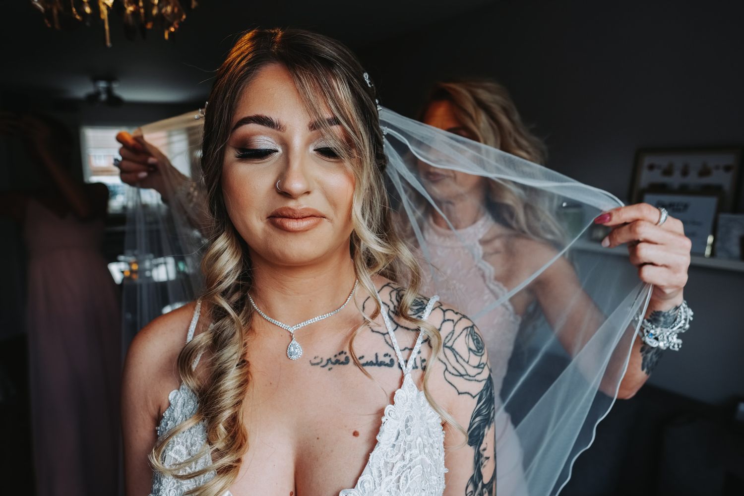 Elegant bridal preparations with flowing veil and sparkling jewelry details.
