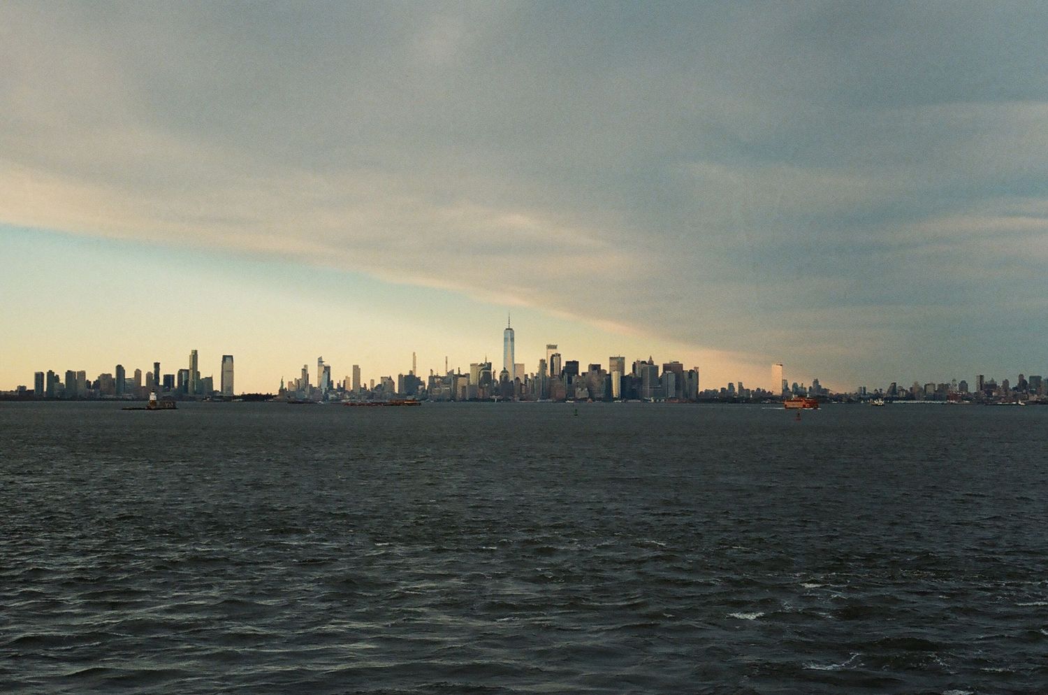 Panoramic view of the Manhattan skyline at dusk seen from across the Hudson River.