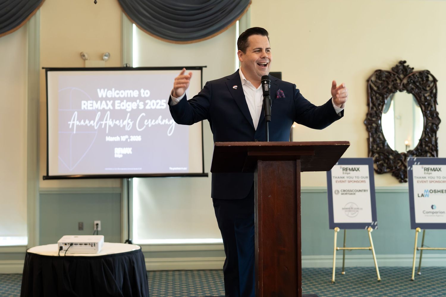 Man speaks at podium during RE/MAX Edge 2025 Annual Awards Ceremony.
