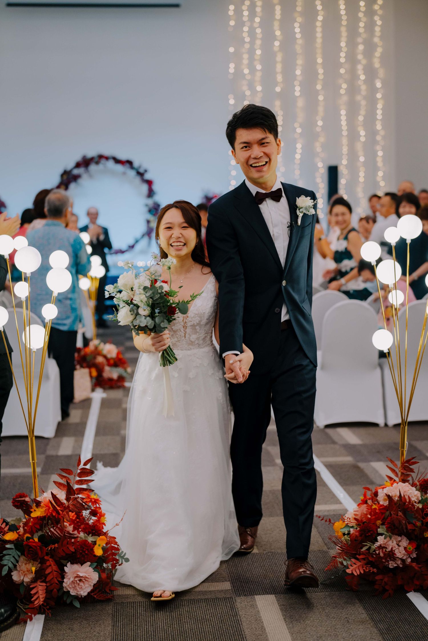 bride and groom marches out as newlyweds
