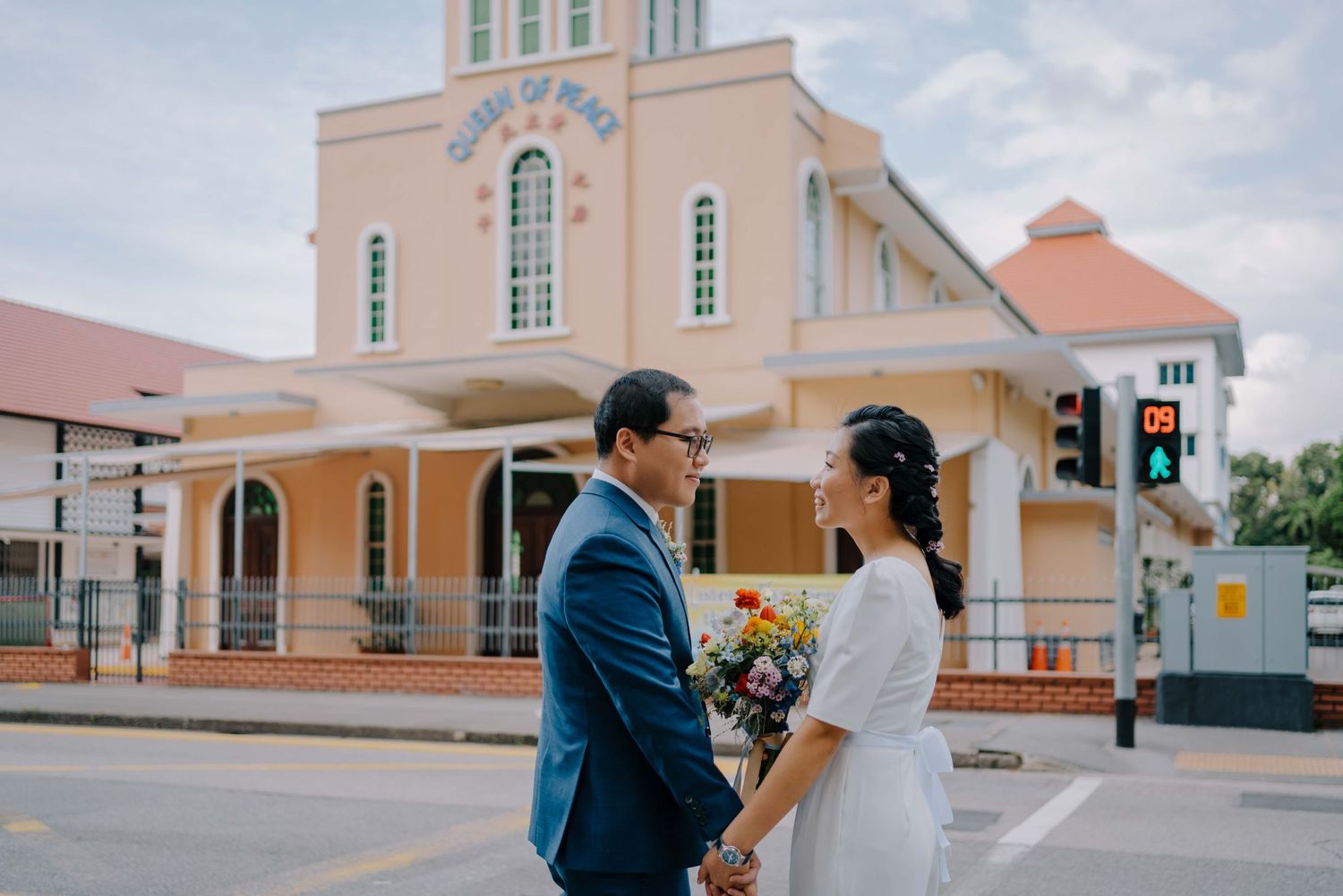 wedding couple walking cross the street