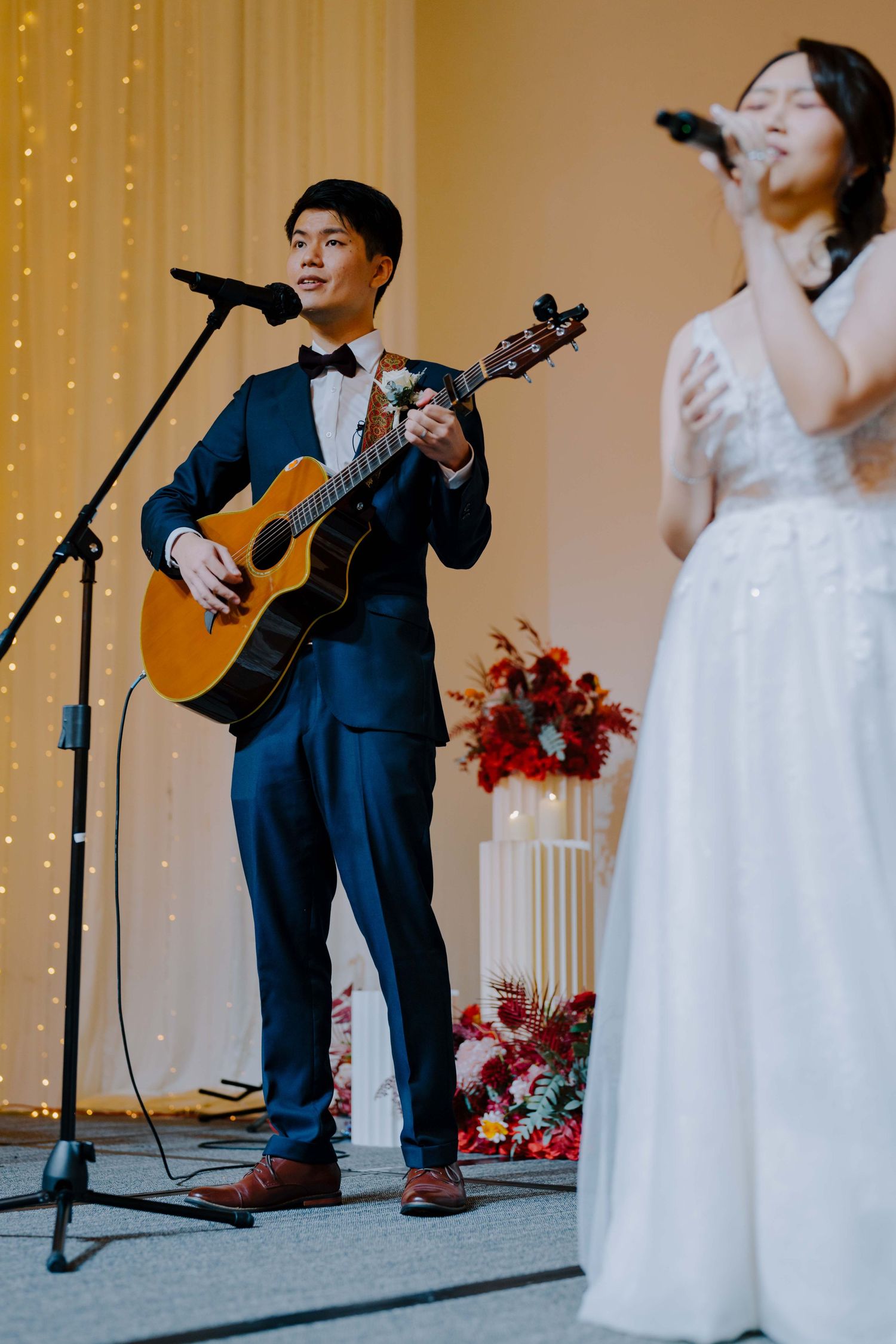 bride and groom perform for their guests at ywca fort canning singapore