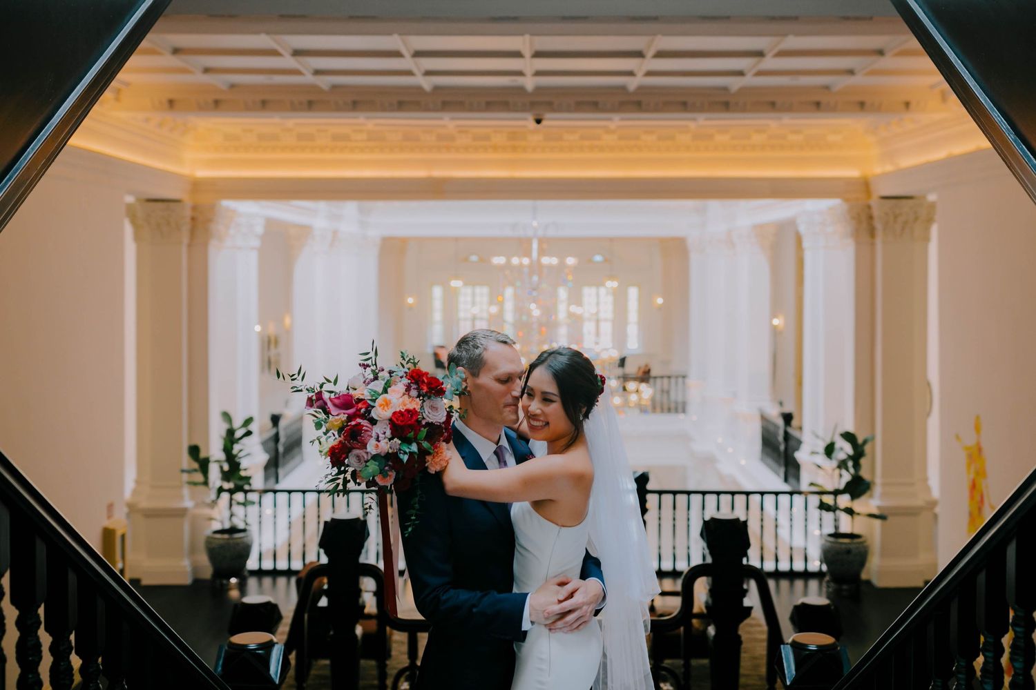 intimate and candid wedding photography at raffles hotel by a documentary-style wedding photographer