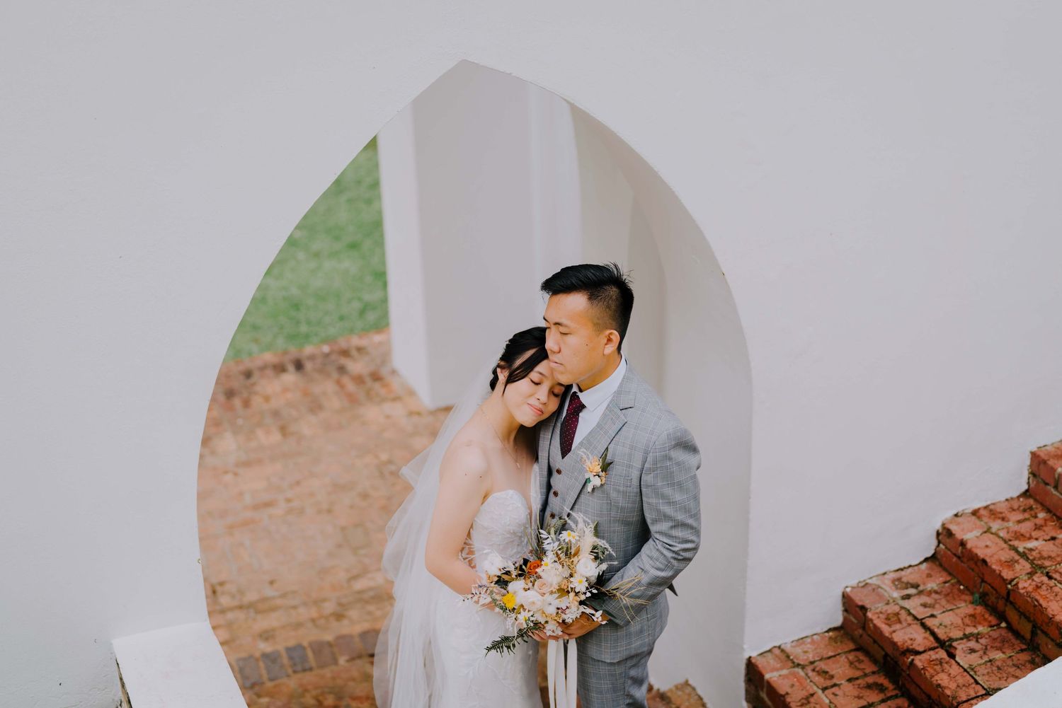 emotional and candid wedding photography at fort canning park by a documentary-style wedding photographer