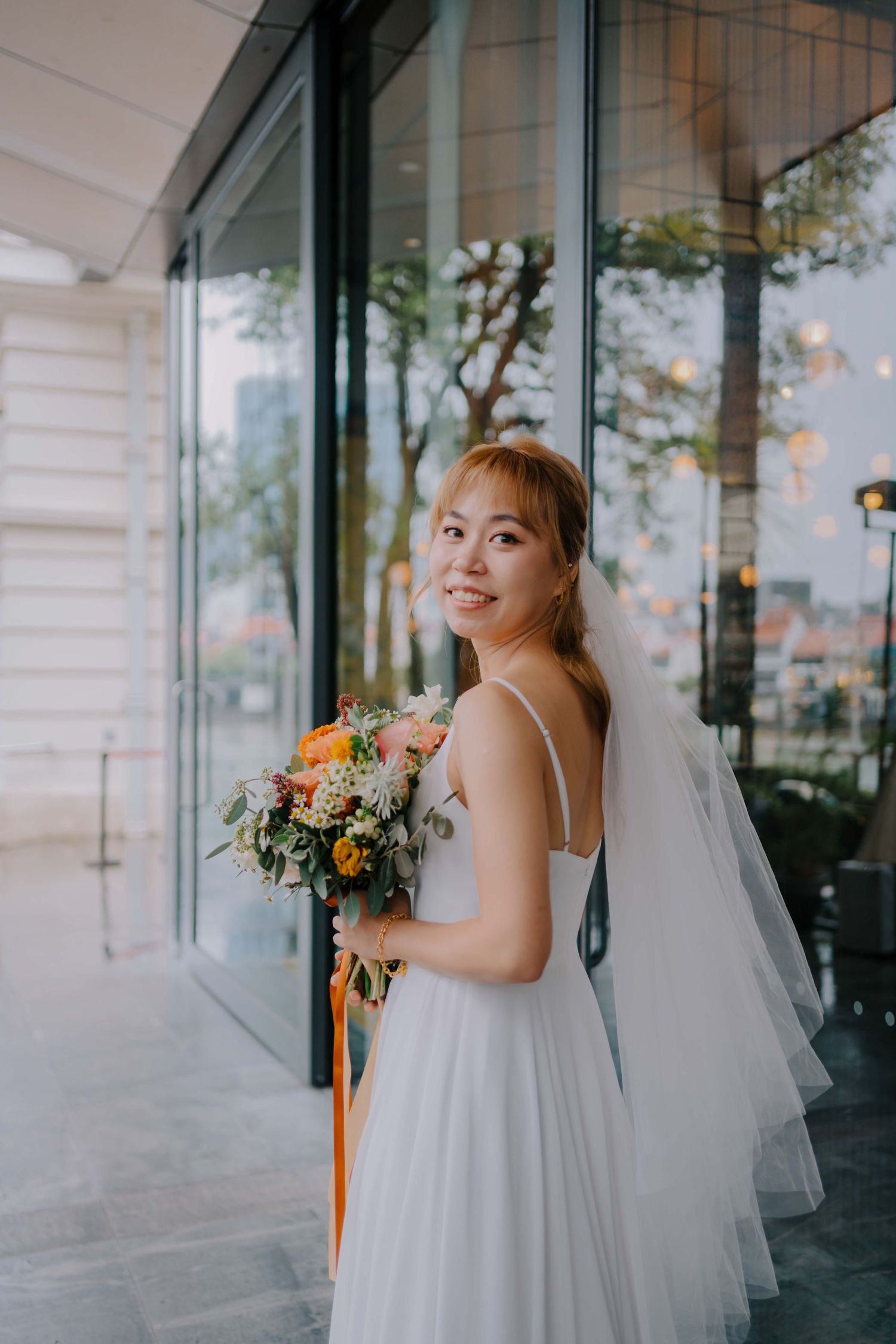 bride holds onto bridal flower bouquet