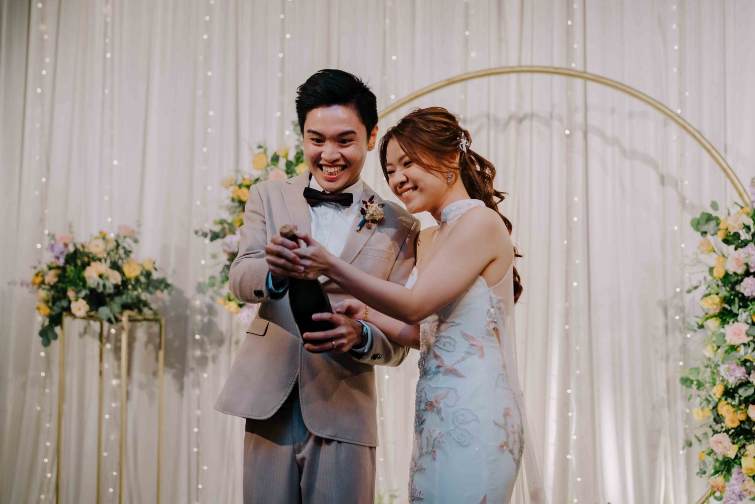 newlywed pop a champagne bottle in sofitel singapore city centre