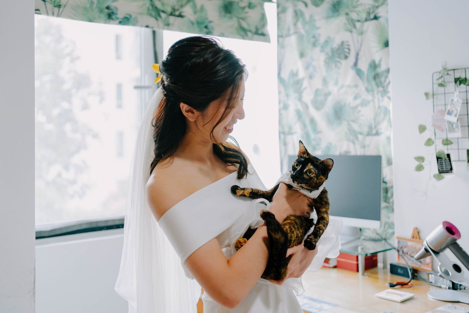 bride with her pet cat on wedding day at glory presbyterian church singapore