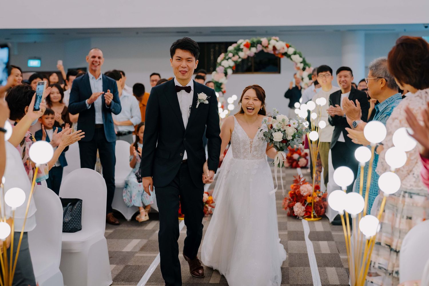 bride and groom marches in as newlyweds