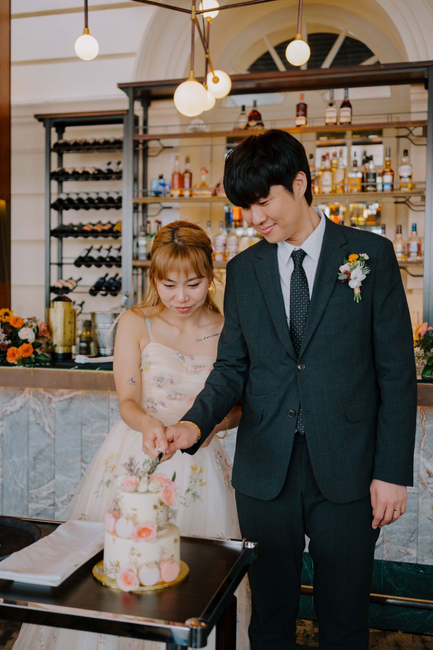 bride and groom cut their wedding cake