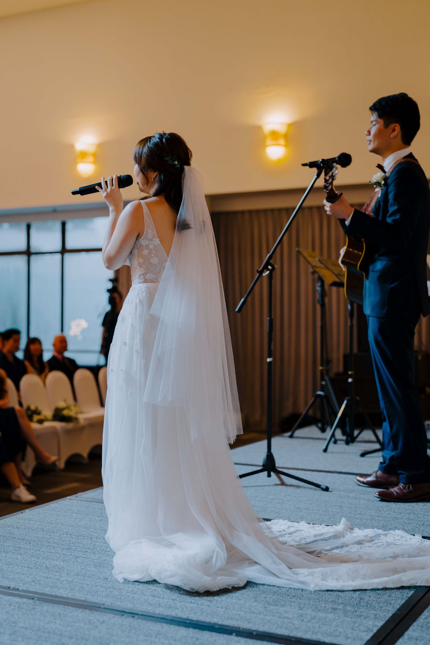 bride and groom perform for their guests at ywca fort canning singapore
