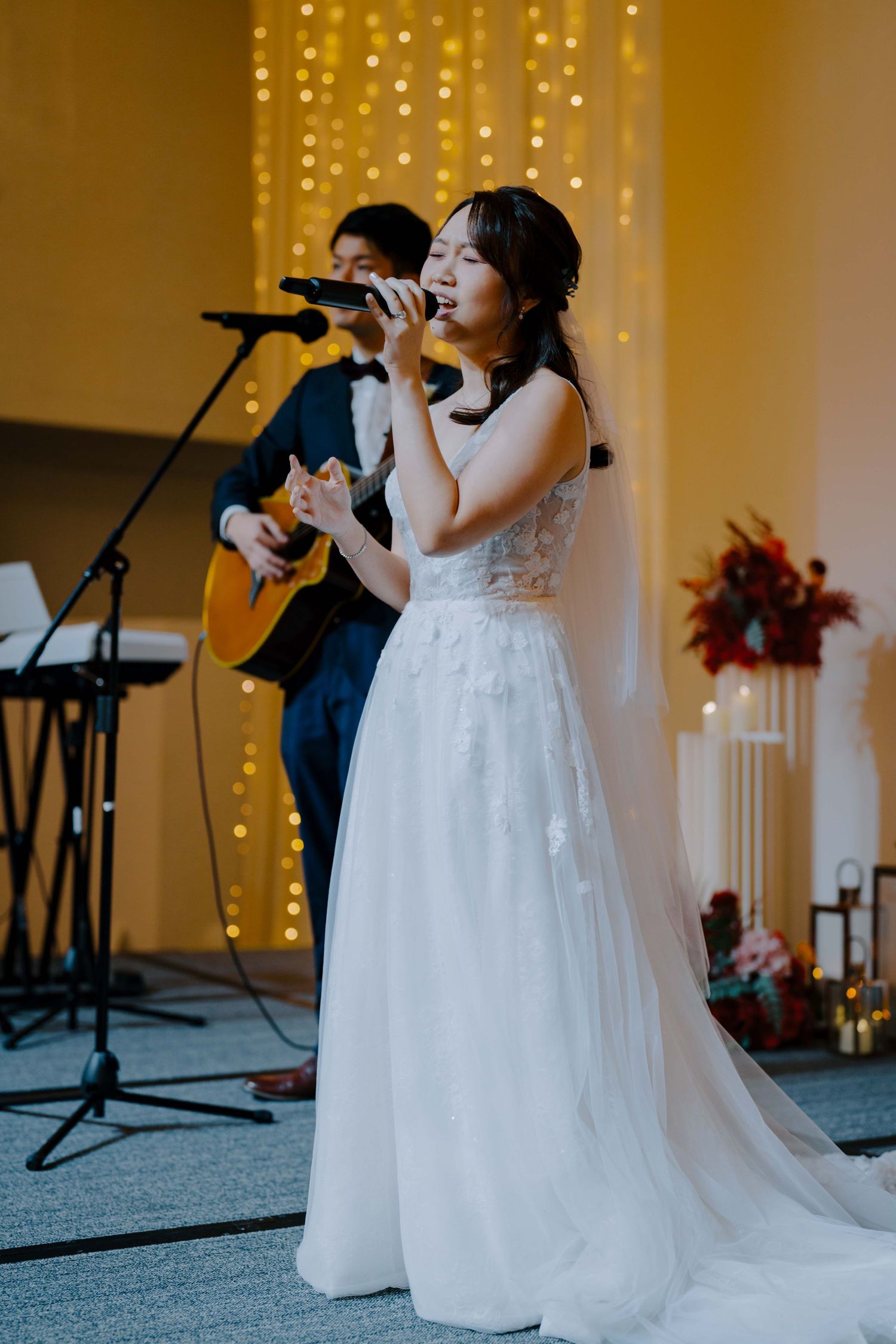 bride and groom perform for their guests at ywca fort canning singapore