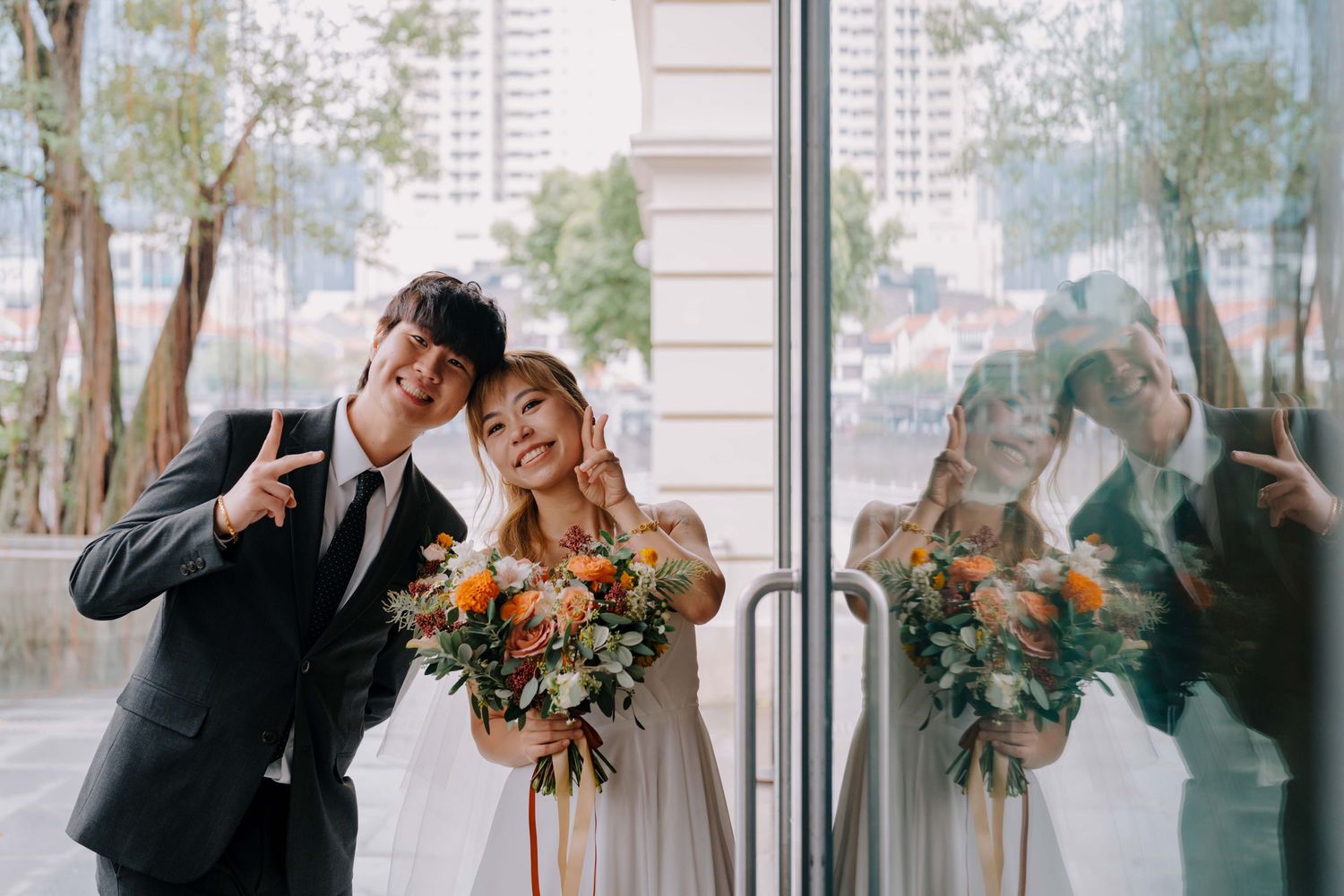 bride and groom pose for the camera before their march in as a newlywed