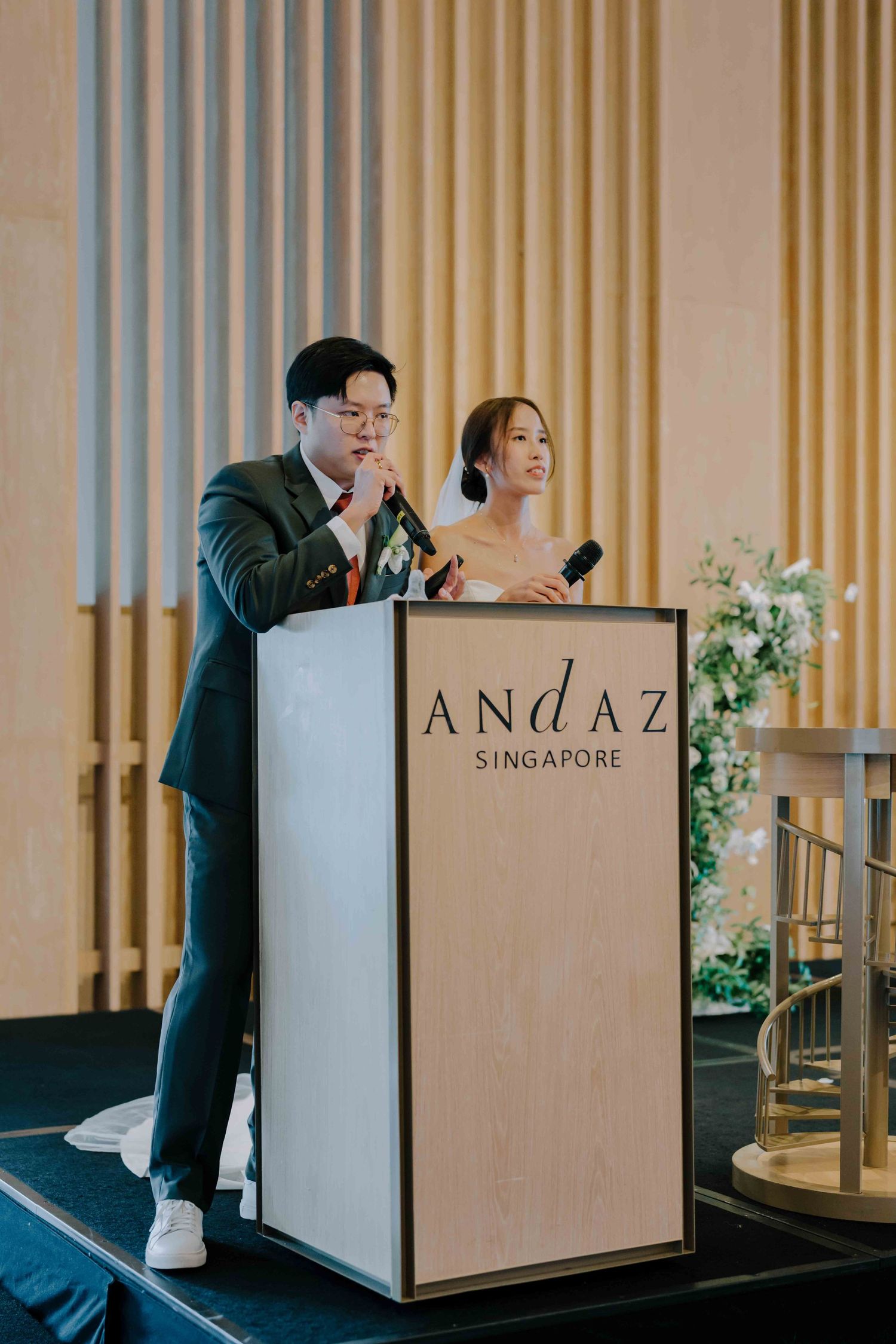 bride and groom giving speech to guests at andaz hotel glasshouse singapore