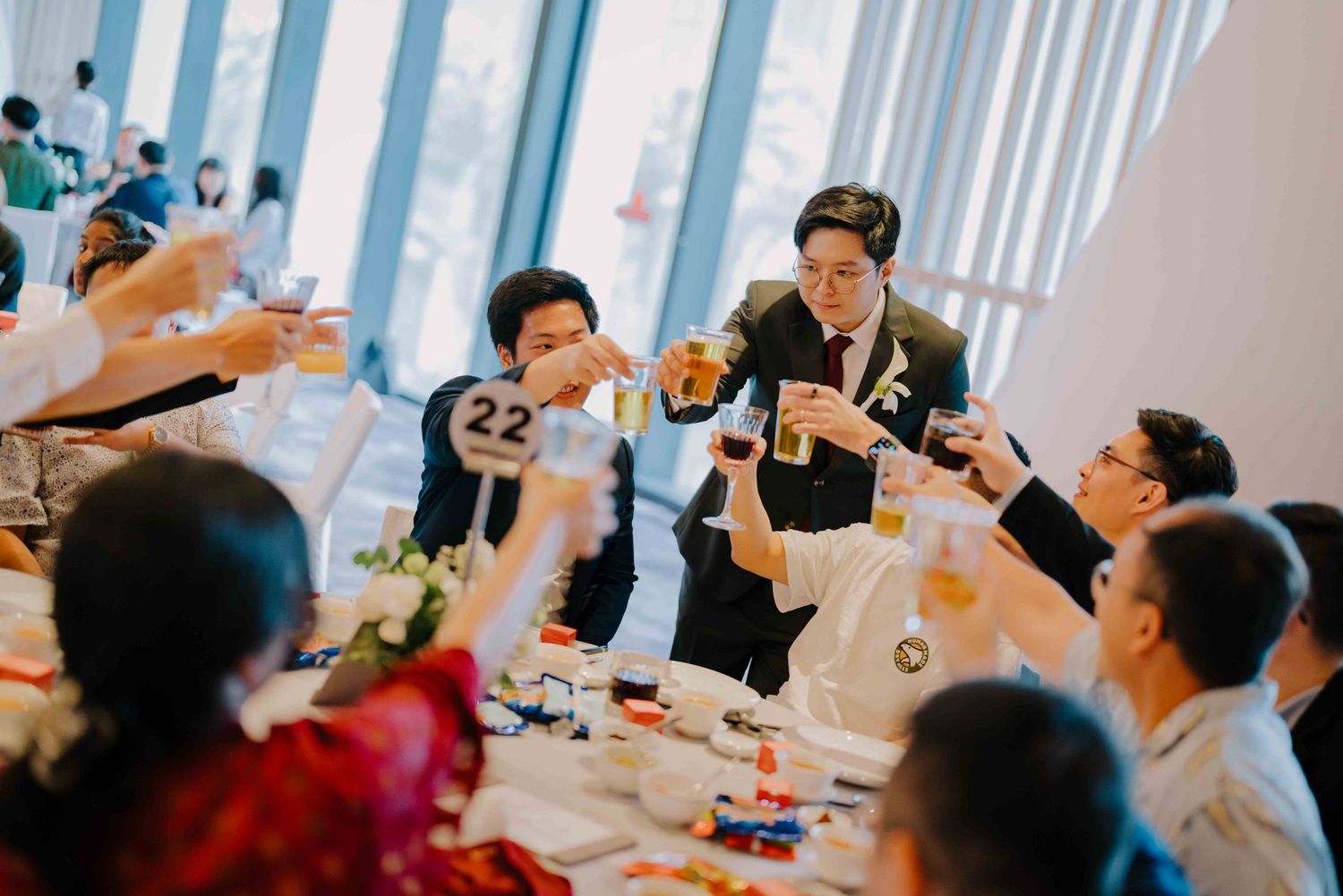 groom and guests at wedding at andaz hotel singapore