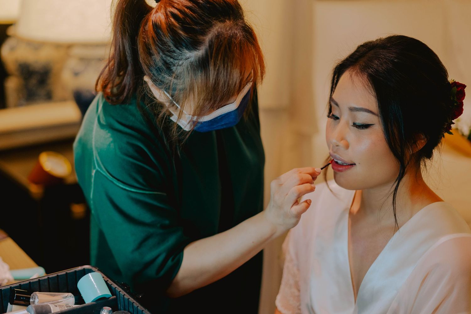 bride getting ready at raffles hotel for outdoor garden wedding
