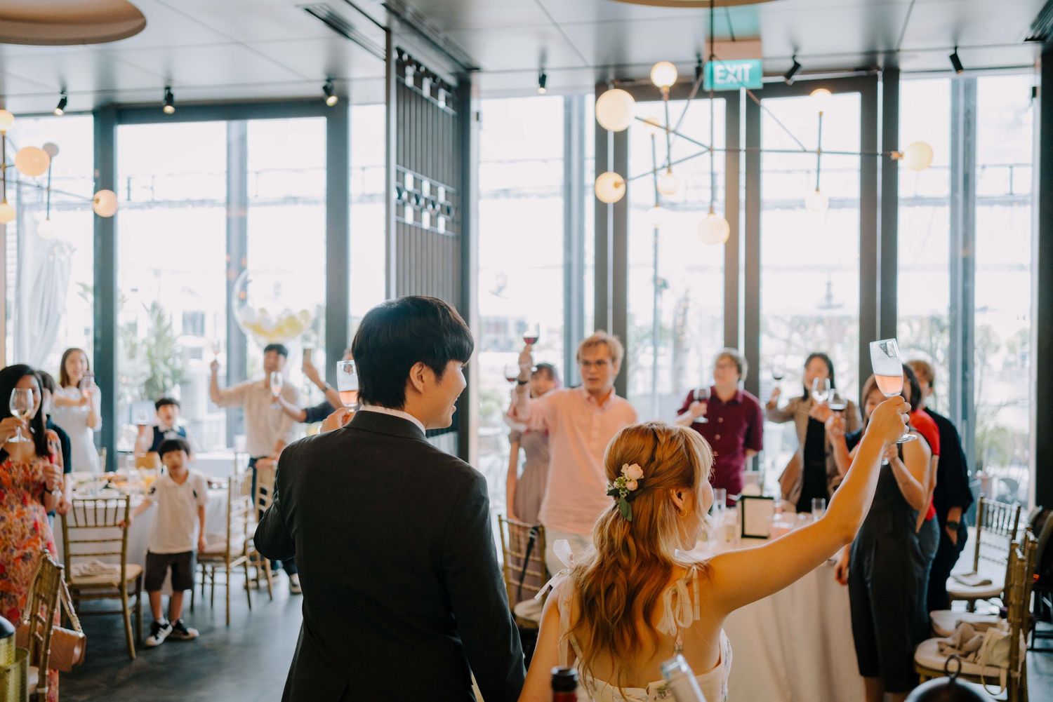 newlywed toasts to their guests on wedding day
