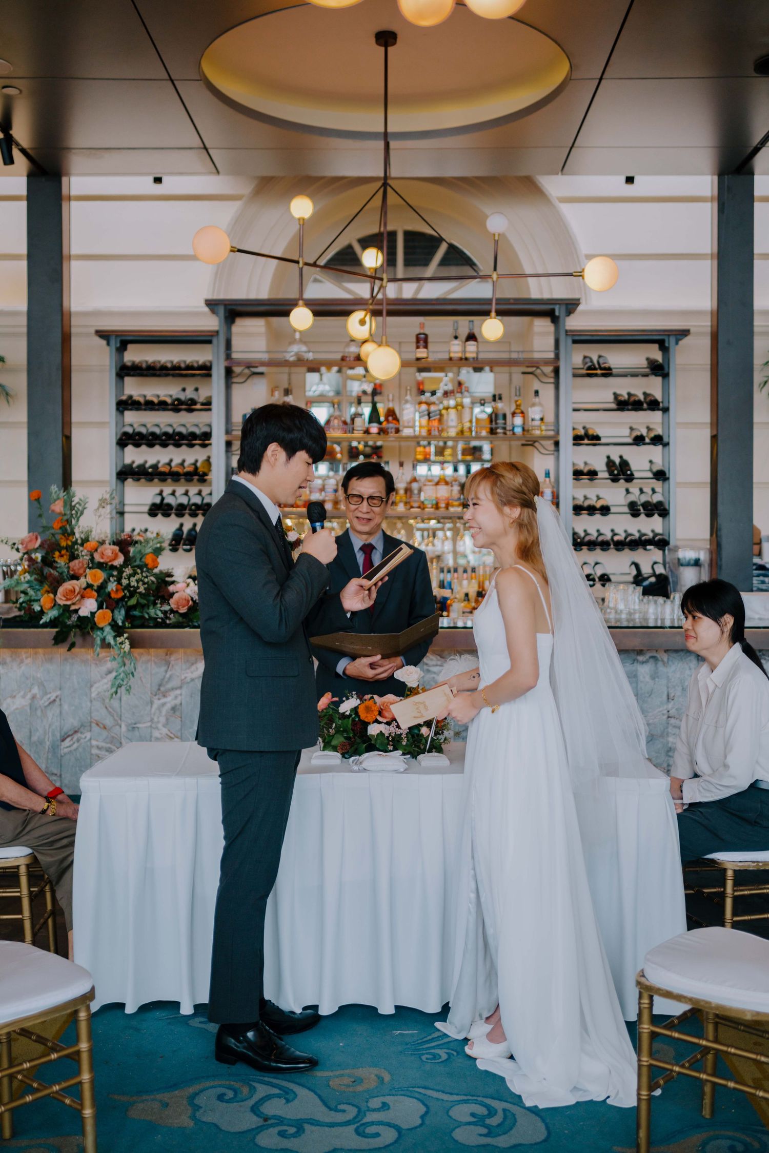 bride and groom reading their vows at their wedding