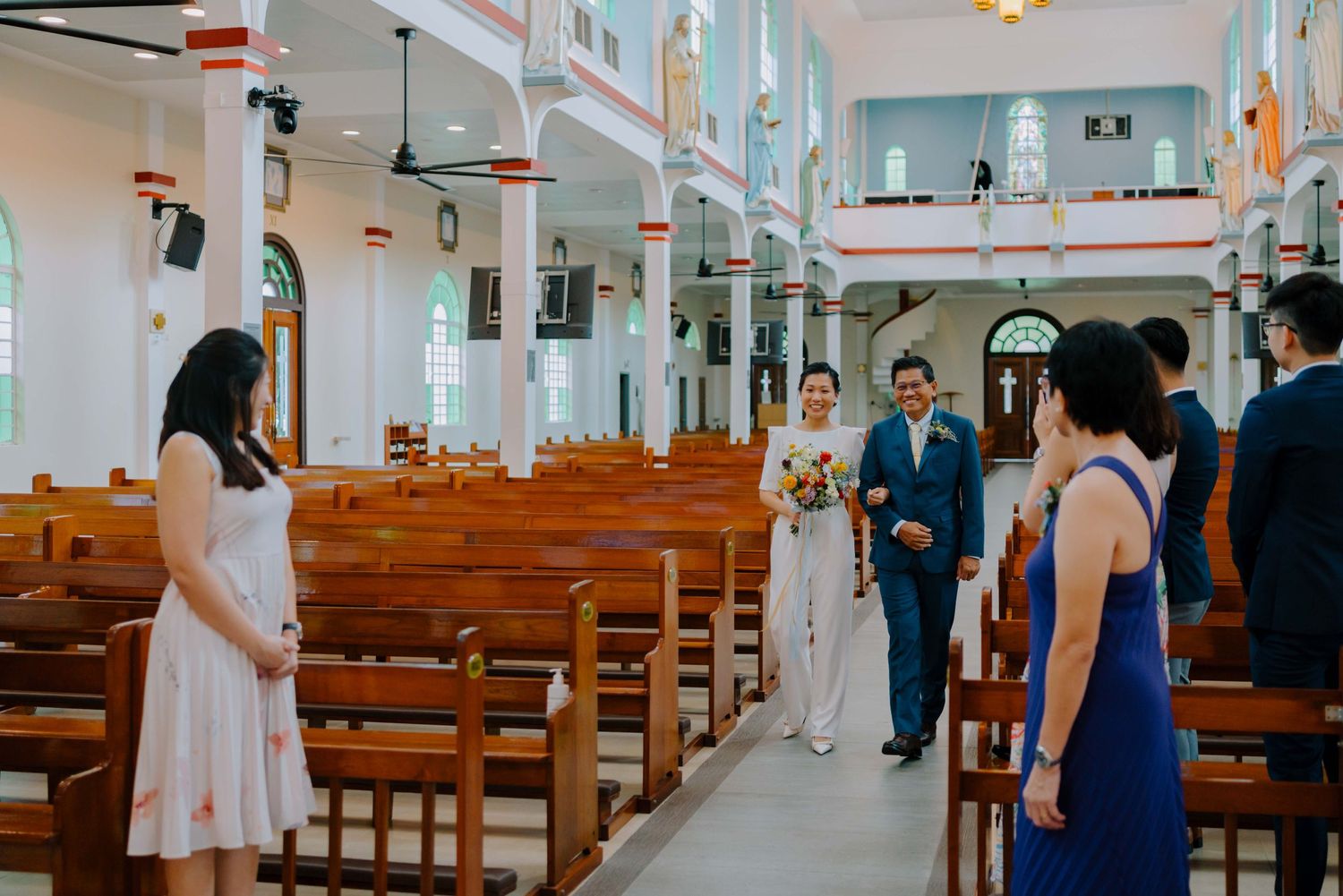 bride's father walking bride down the aisle in church. shot by annopano