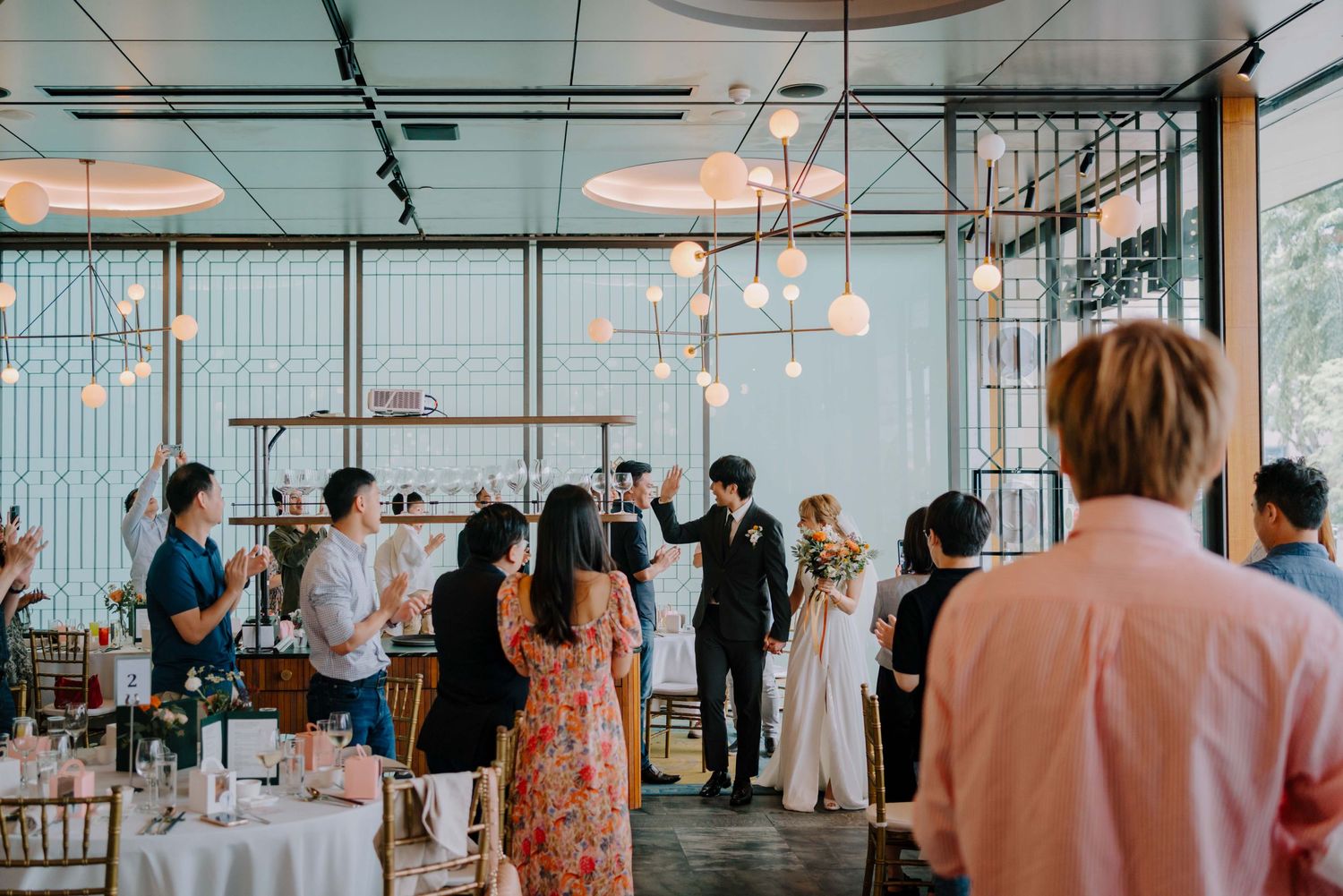 newlywed march in at their wedding at empress acm singapore