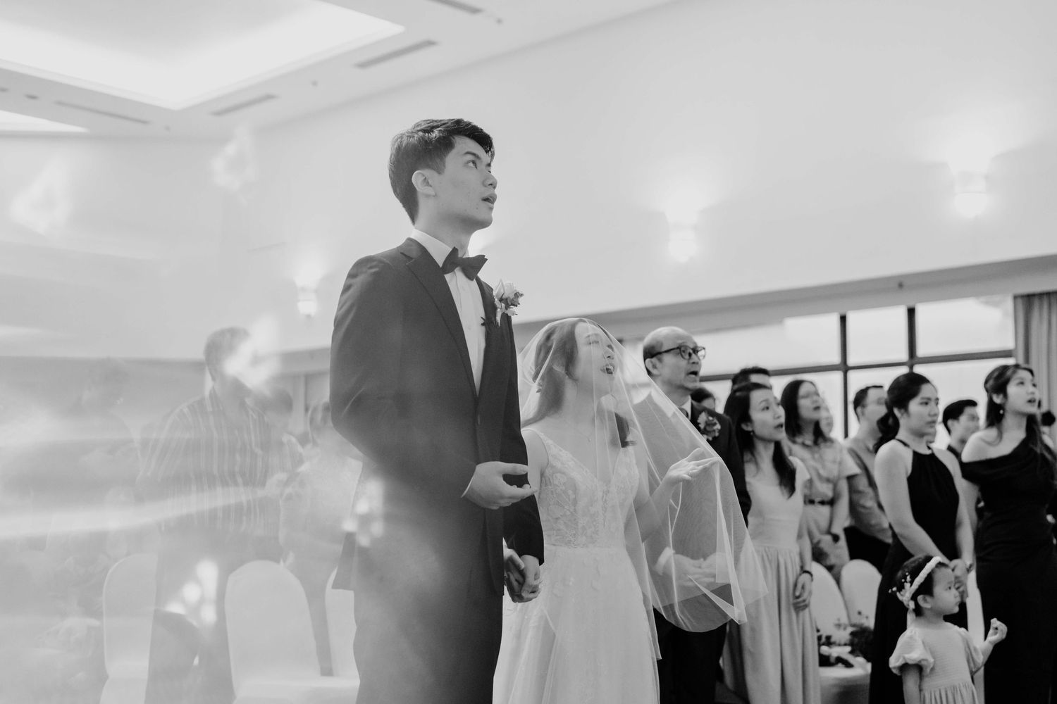 church wedding ceremony at ywca fort canning hotel where groom and bride worship together photographed by wedding photographer in singapore
