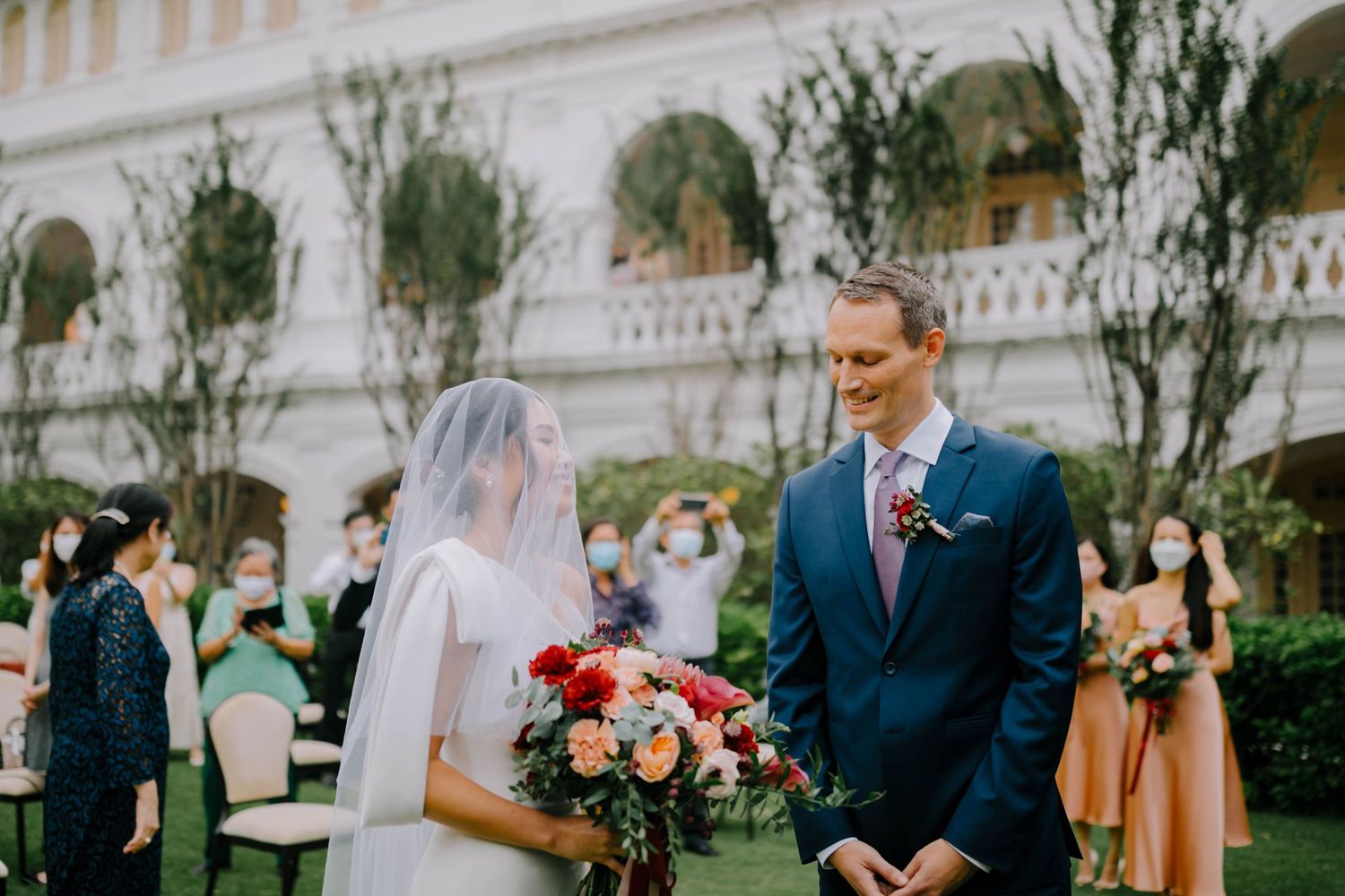 intimate and candid wedding photography at raffles hotel by a documentary-style wedding photographer