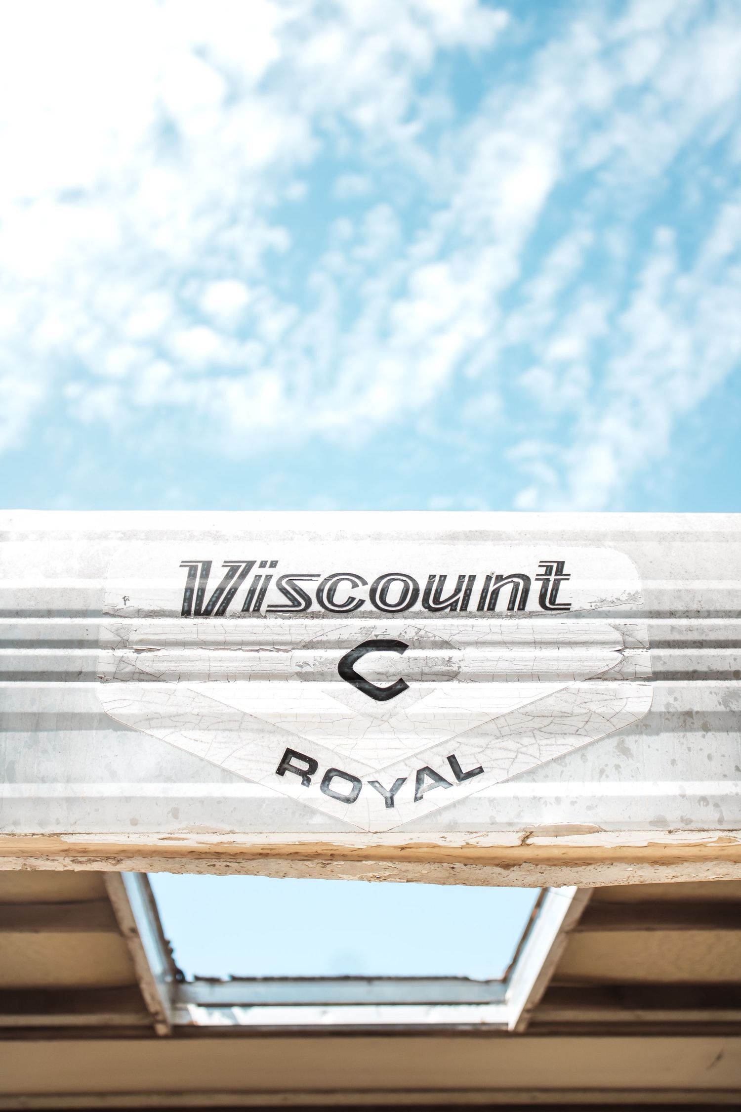 Vintage Viscount Royal logo text detail shown in chrome lettering against a white painted surface.
