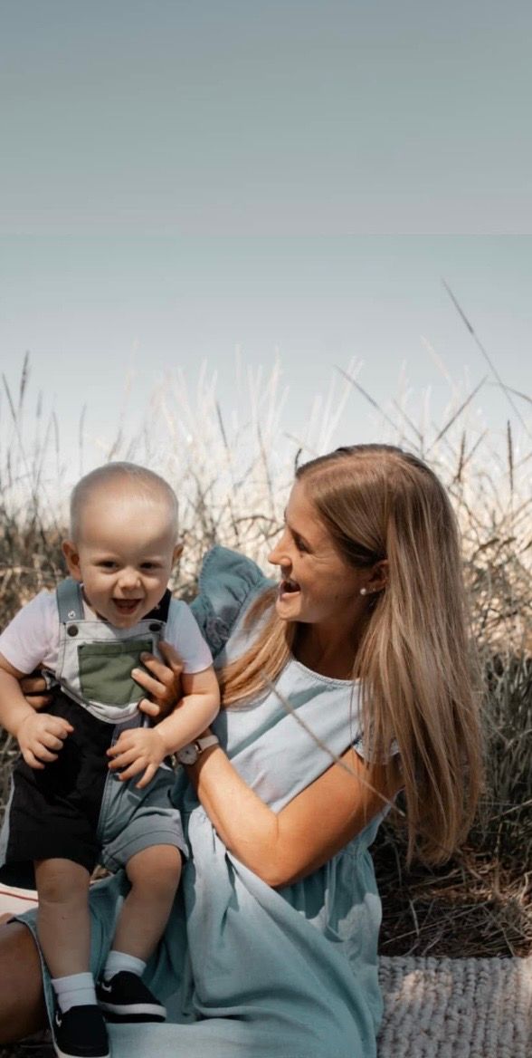 A heartwarming series of candid moments between a parent and baby sitting outdoors during golden hour.