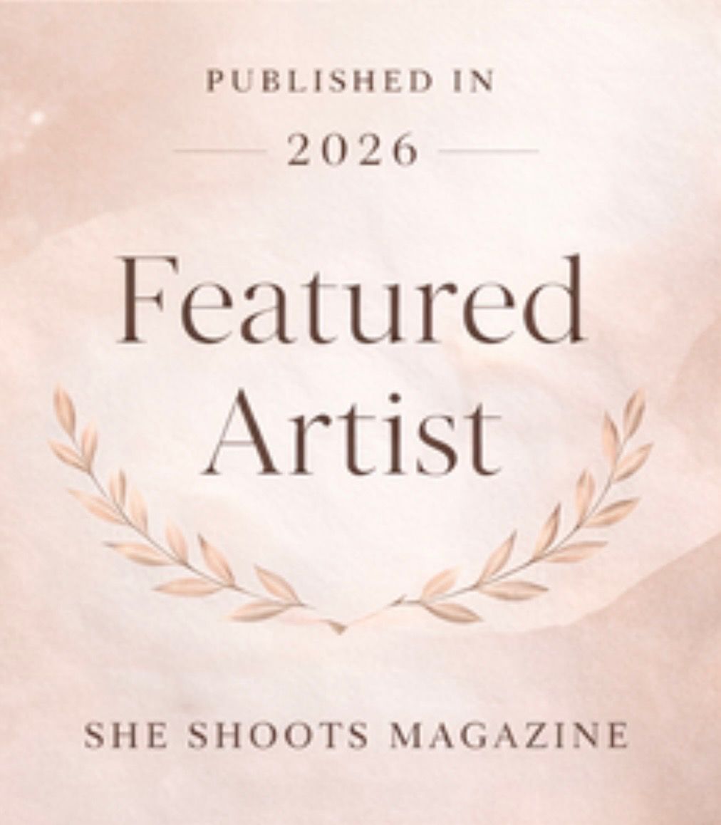 Elegant pink and beige text design featuring 'Published in 2026' and 'Featured Artist' with decorative floral elements.