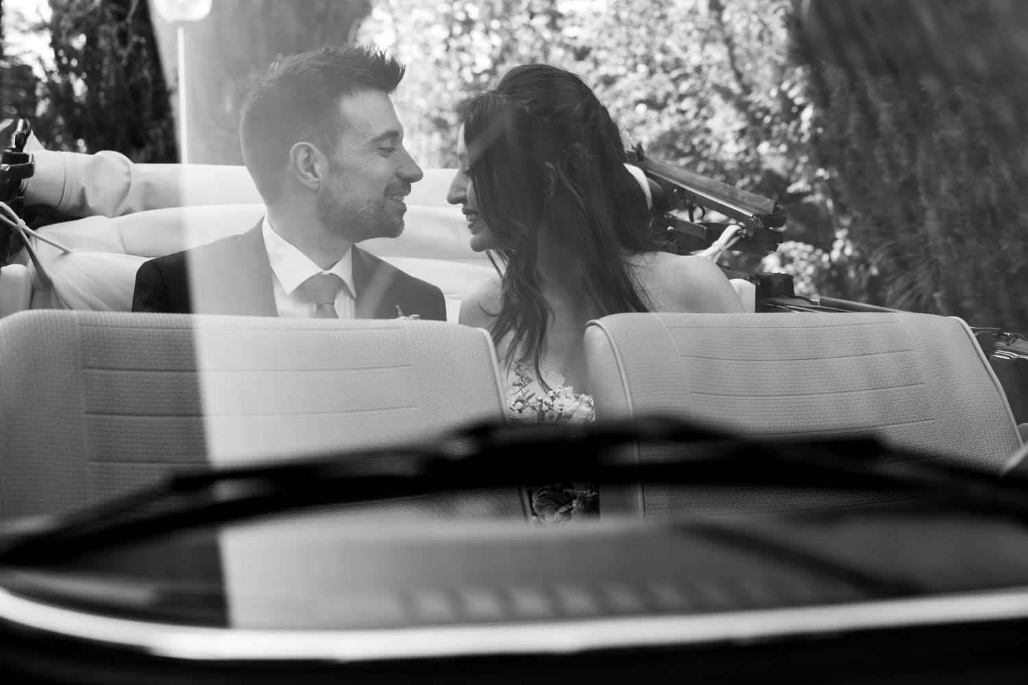 Black and white detail shot of wedding reception decor and table settings.