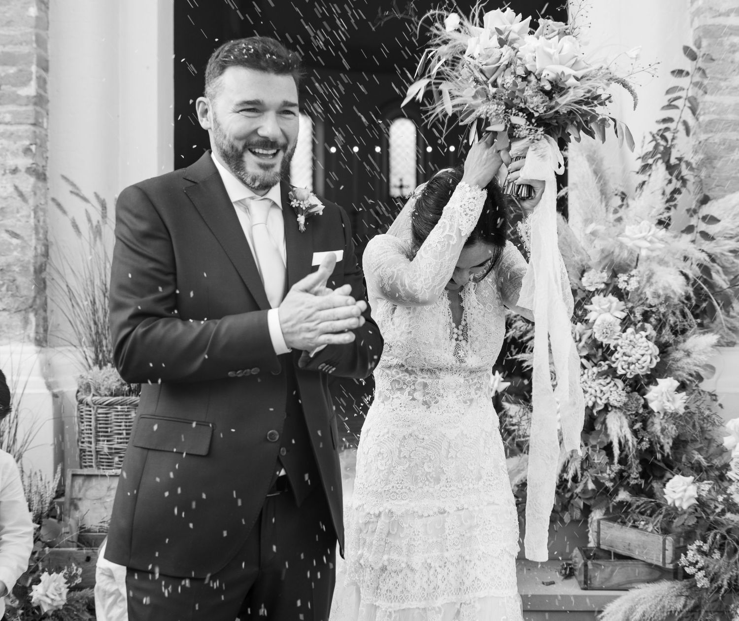 Black and white wedding sequence with elegant floral decorations and confetti celebrations.