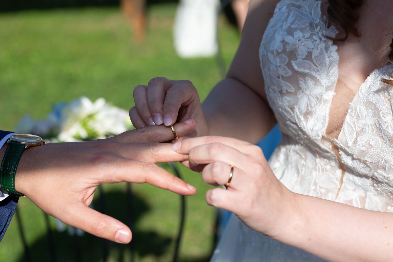 Series of close-up shots showing wedding ring exchange ceremony.