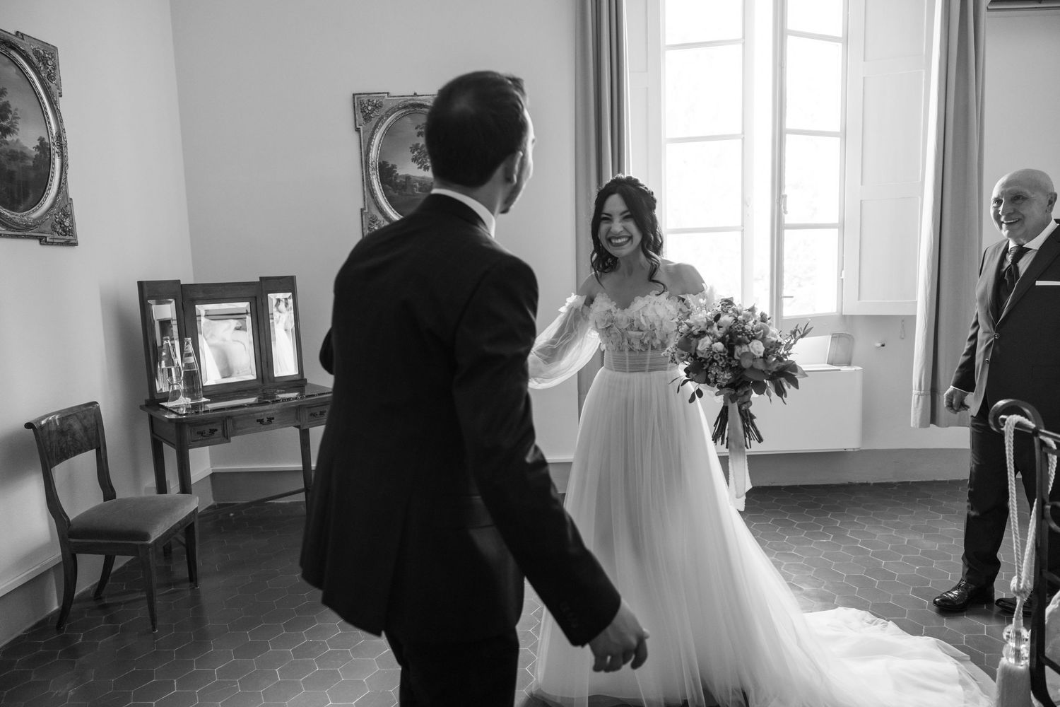 Black and white candid moments captured during wedding preparation.
