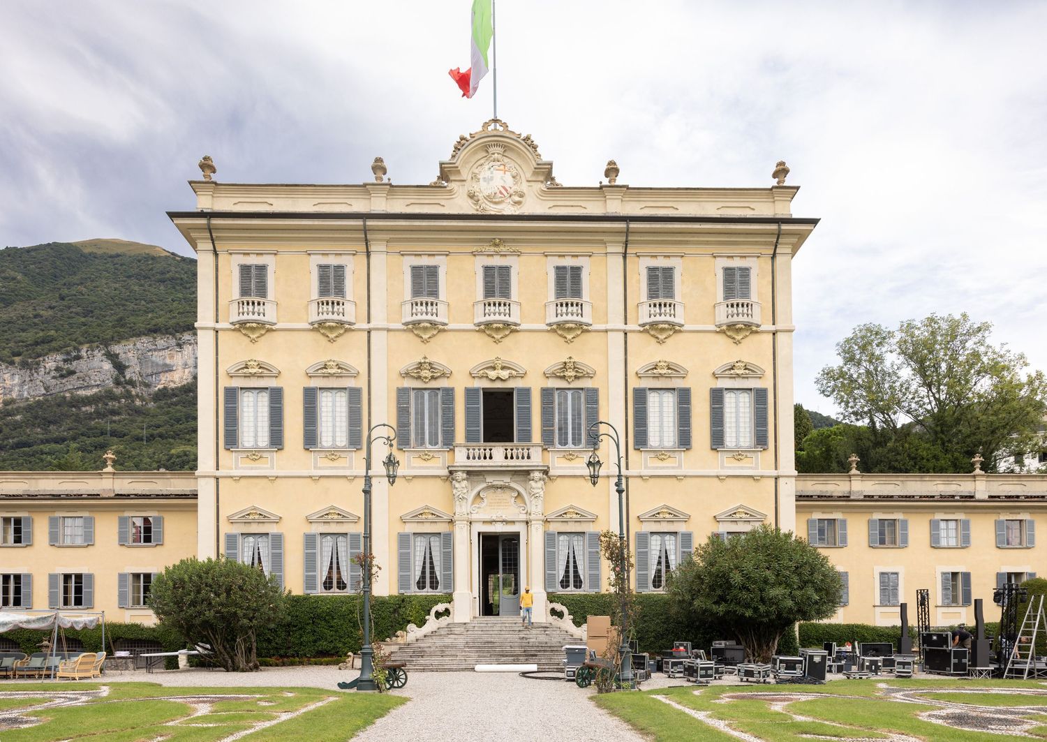 Grand Italian villa with symmetrical architecture and manicured gardens viewed from different angles.