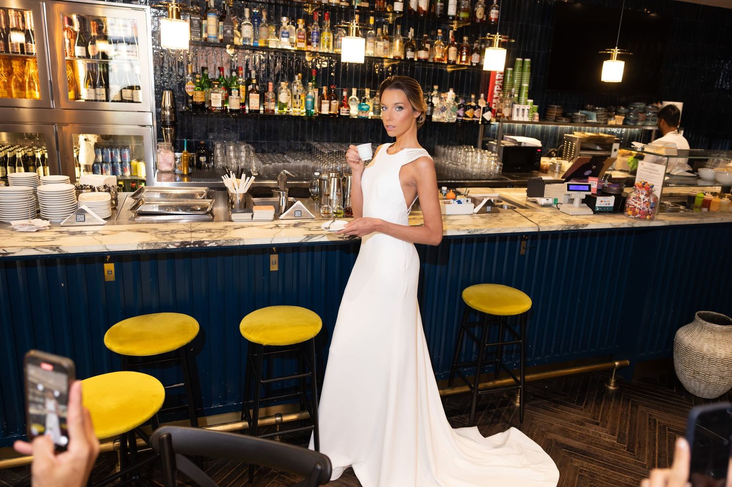 Modern bar interior serves as sophisticated backdrop for bridal photography session.