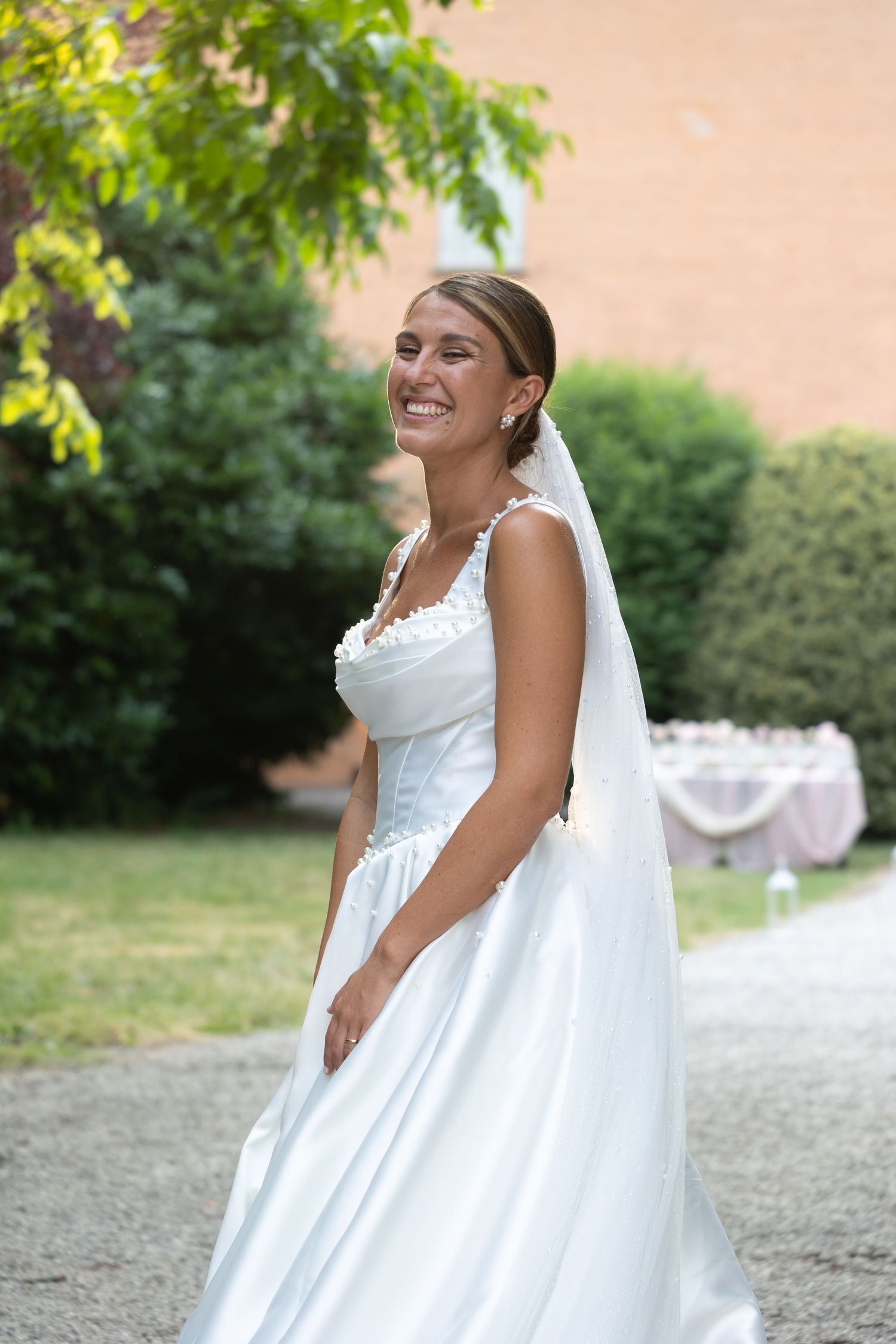 Sequence of bridal portraits in garden setting with flowing white dress.