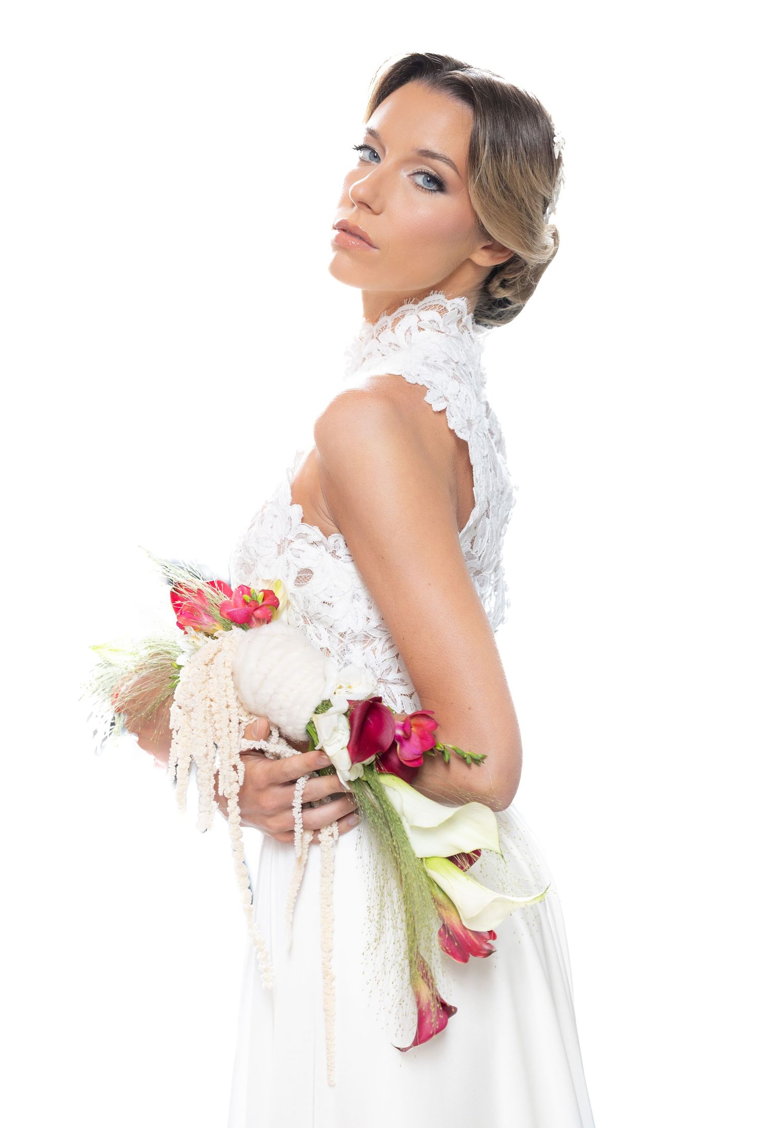 Ethereal bridal portrait series with white lace gown against clean background.