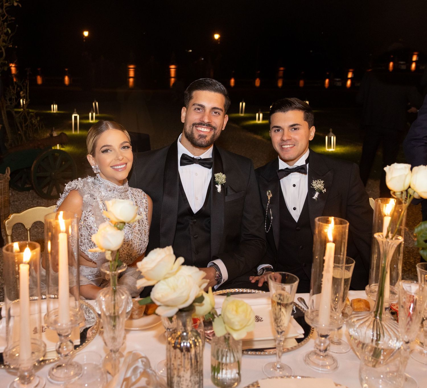 Formal dinner party table setting with elegant decor and candlelight.
