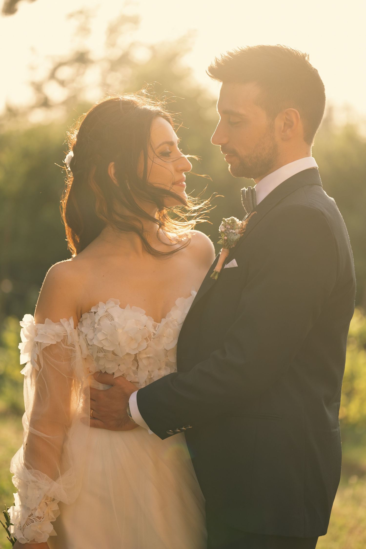 Golden hour wedding portrait capturing an intimate moment between newlyweds.