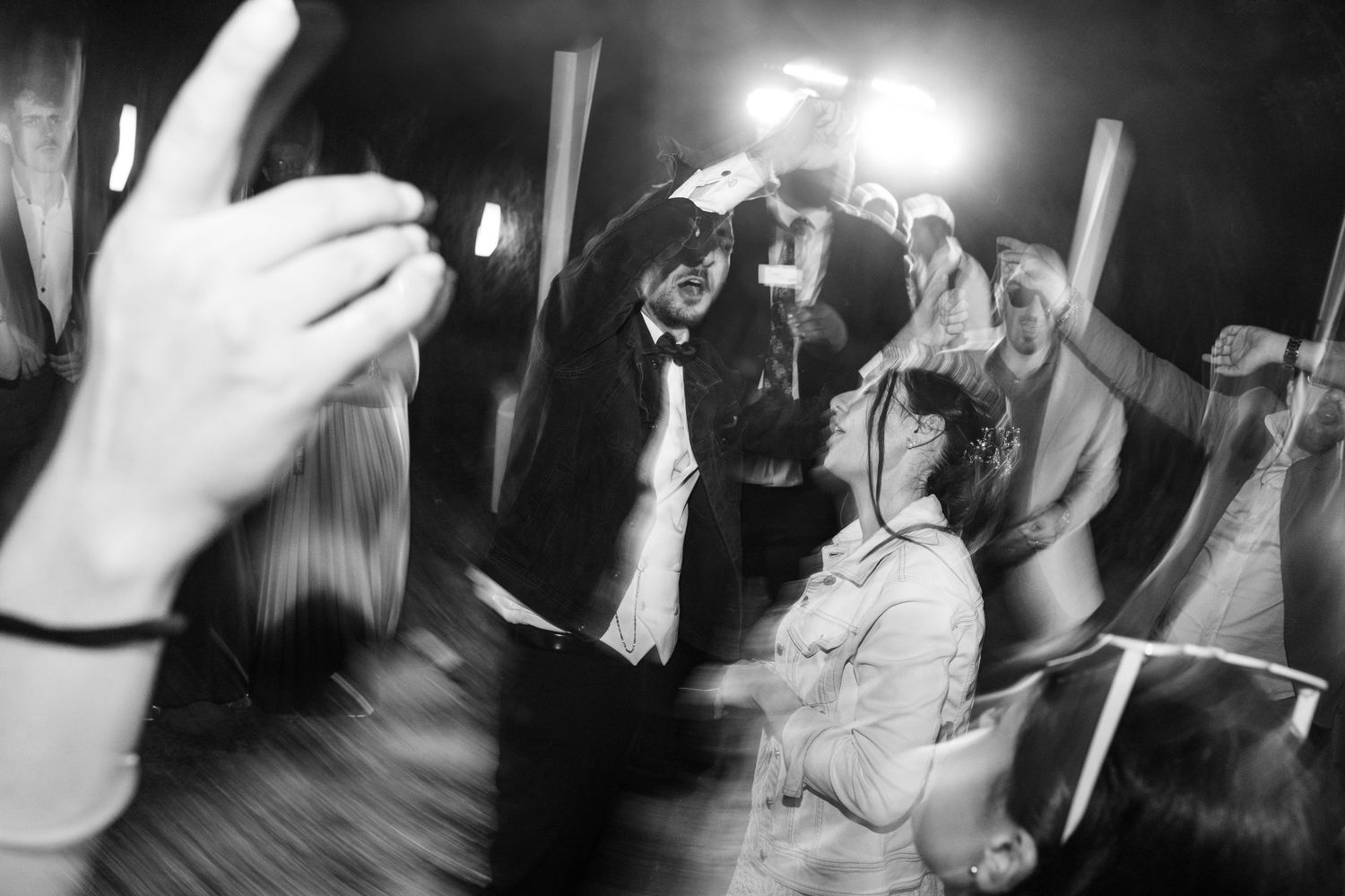 Black and white photos of wedding reception dancing and celebrations.