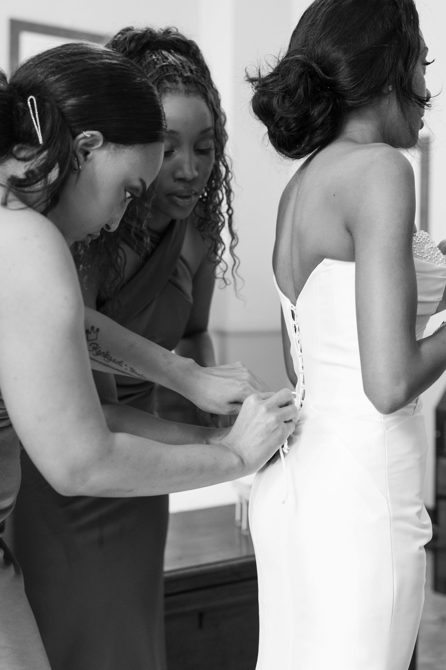 A series of black and white photos showing two people embracing and leaning over a sink.