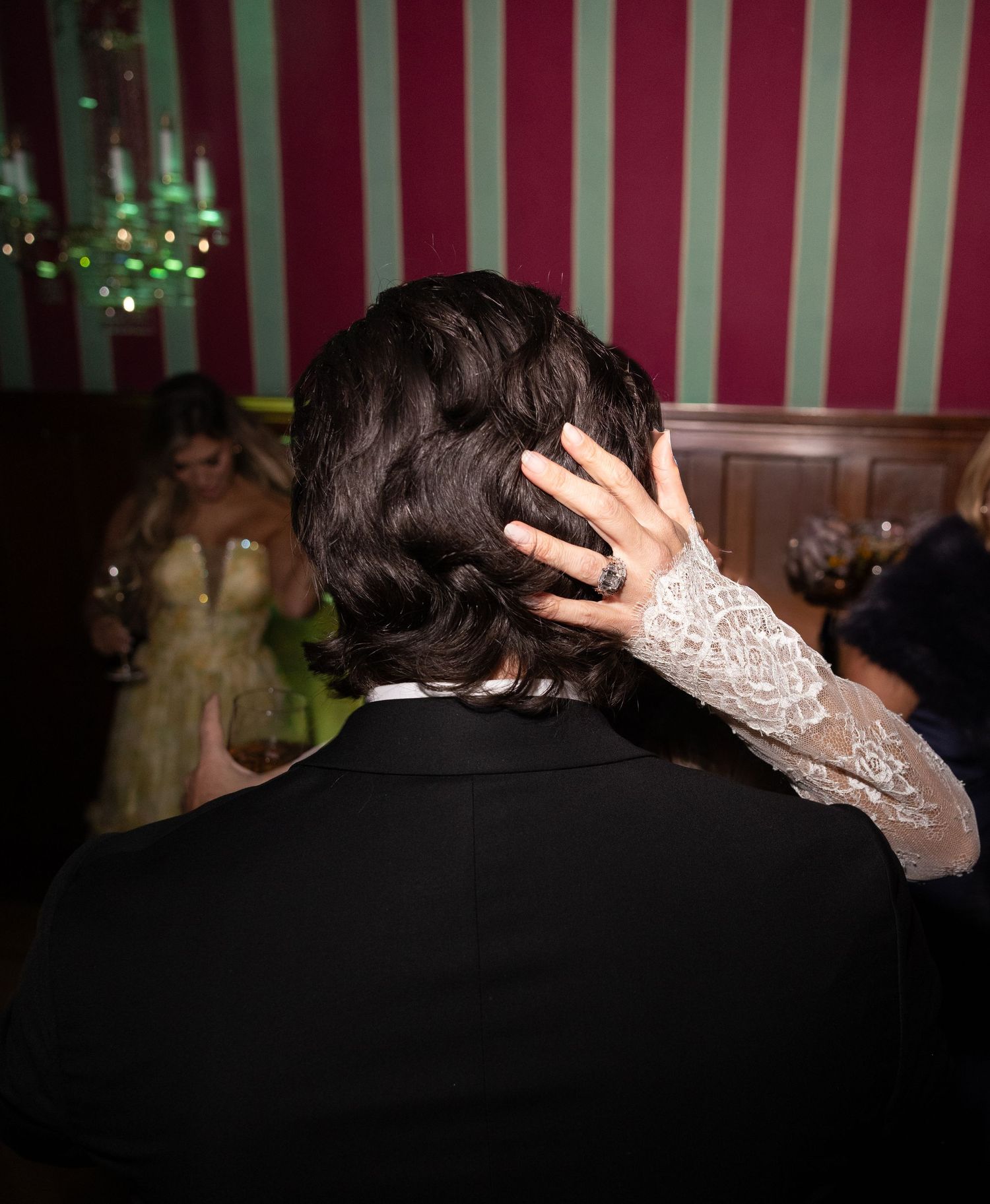 A sequence of photos showing hands wearing jewelry touching the back of someone's head during a formal event.