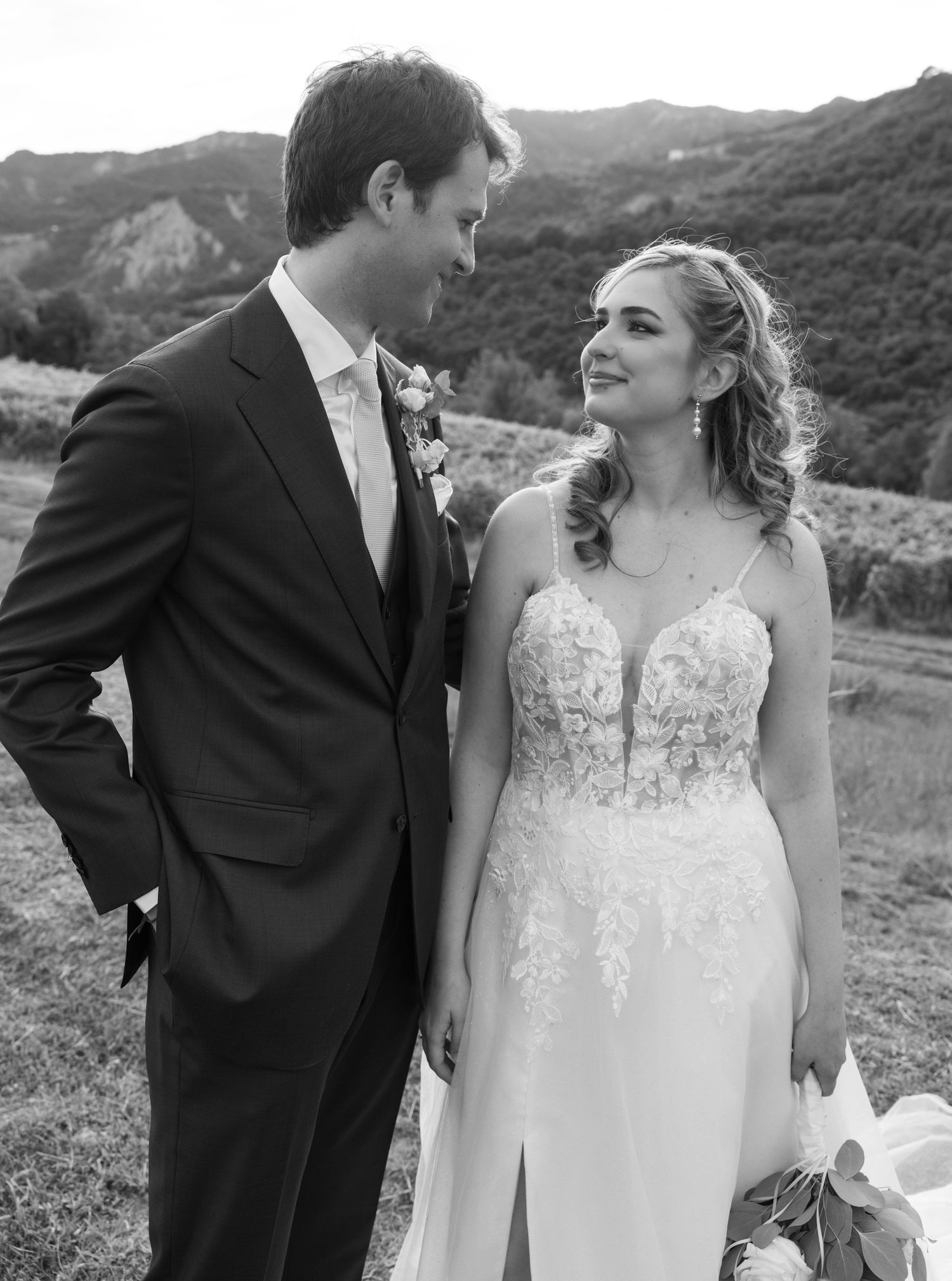 A couple sharing intimate moments during their vineyard wedding photoshoot.