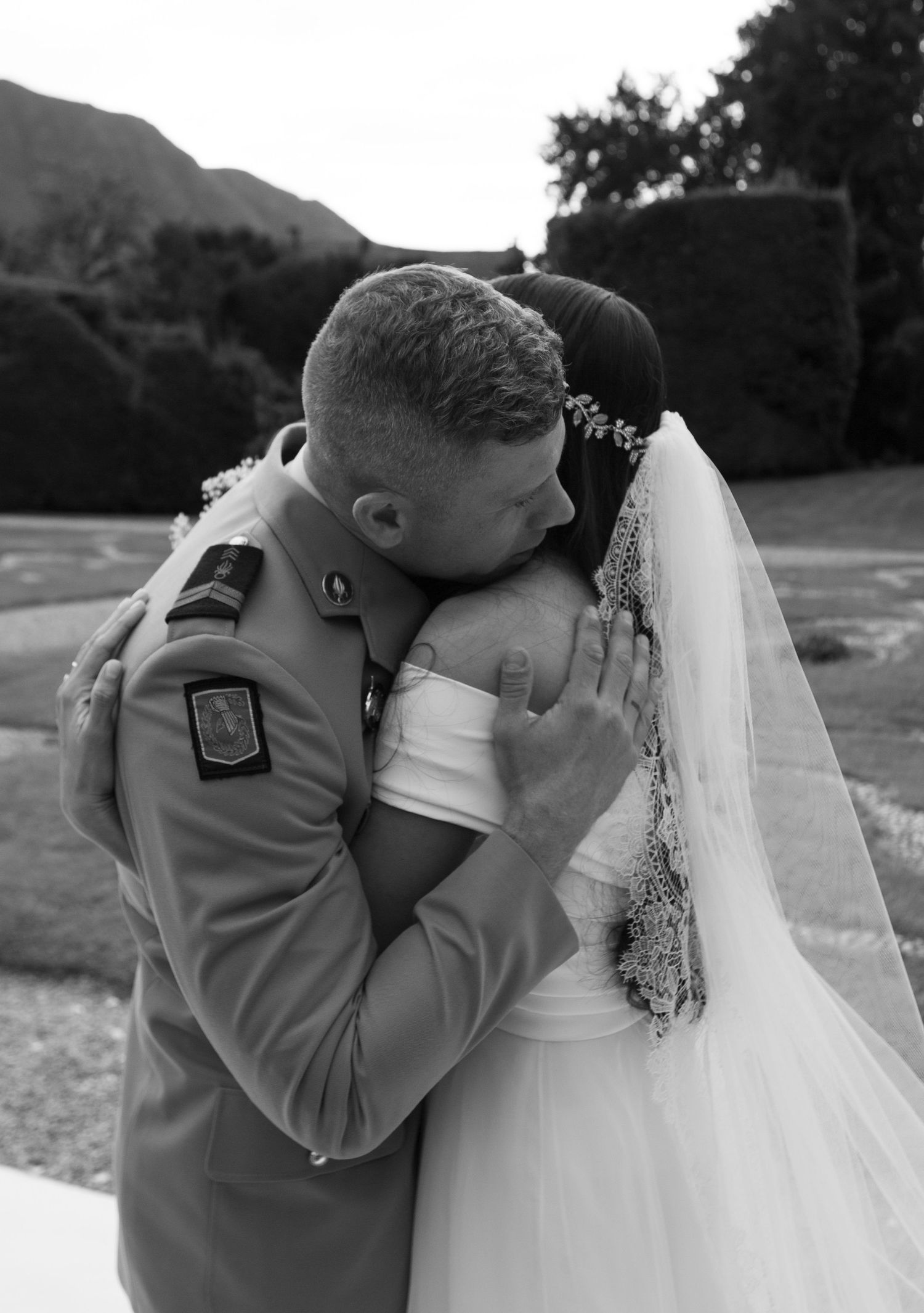 Black and white photo series showing an intimate wedding moment between newlyweds.