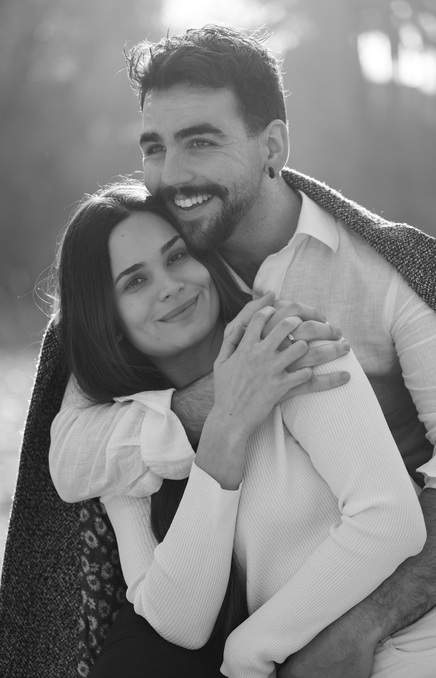 Black and white romantic couple photoshoot showing intimate embraces and tender moments.