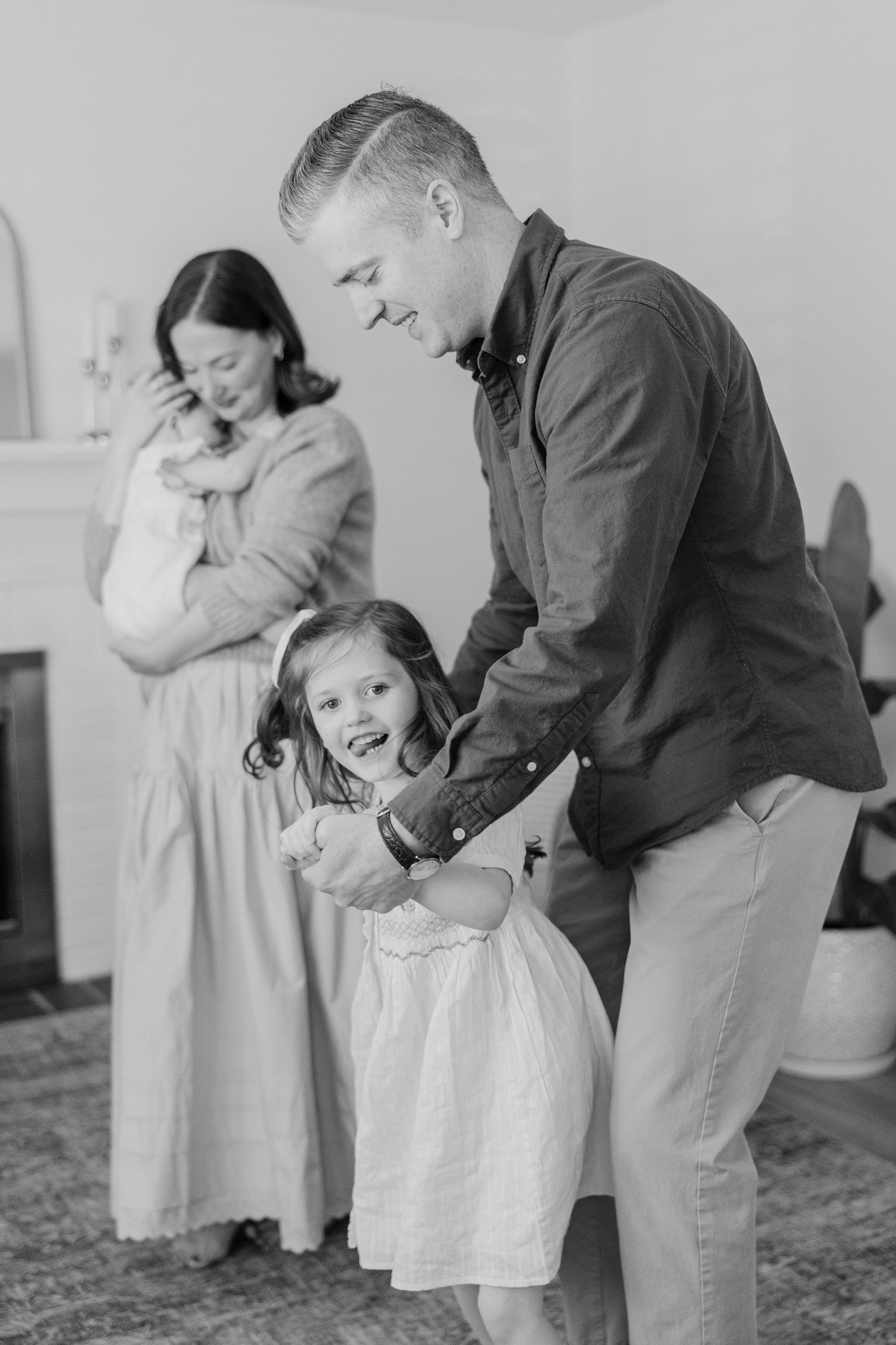 A heartwarming black and white sequence shows playful interactions and tender moments between people in white dresses and suits.