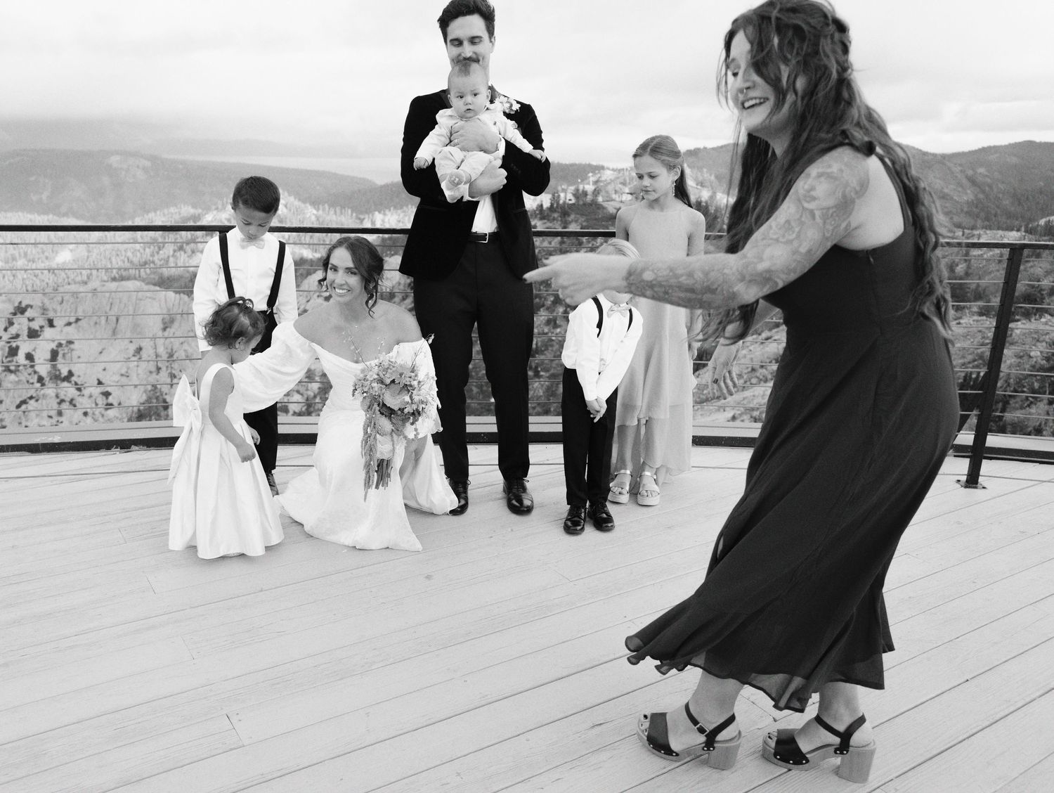 A series of black and white dance photos showing couples in formal wear dancing together on an outdoor deck.